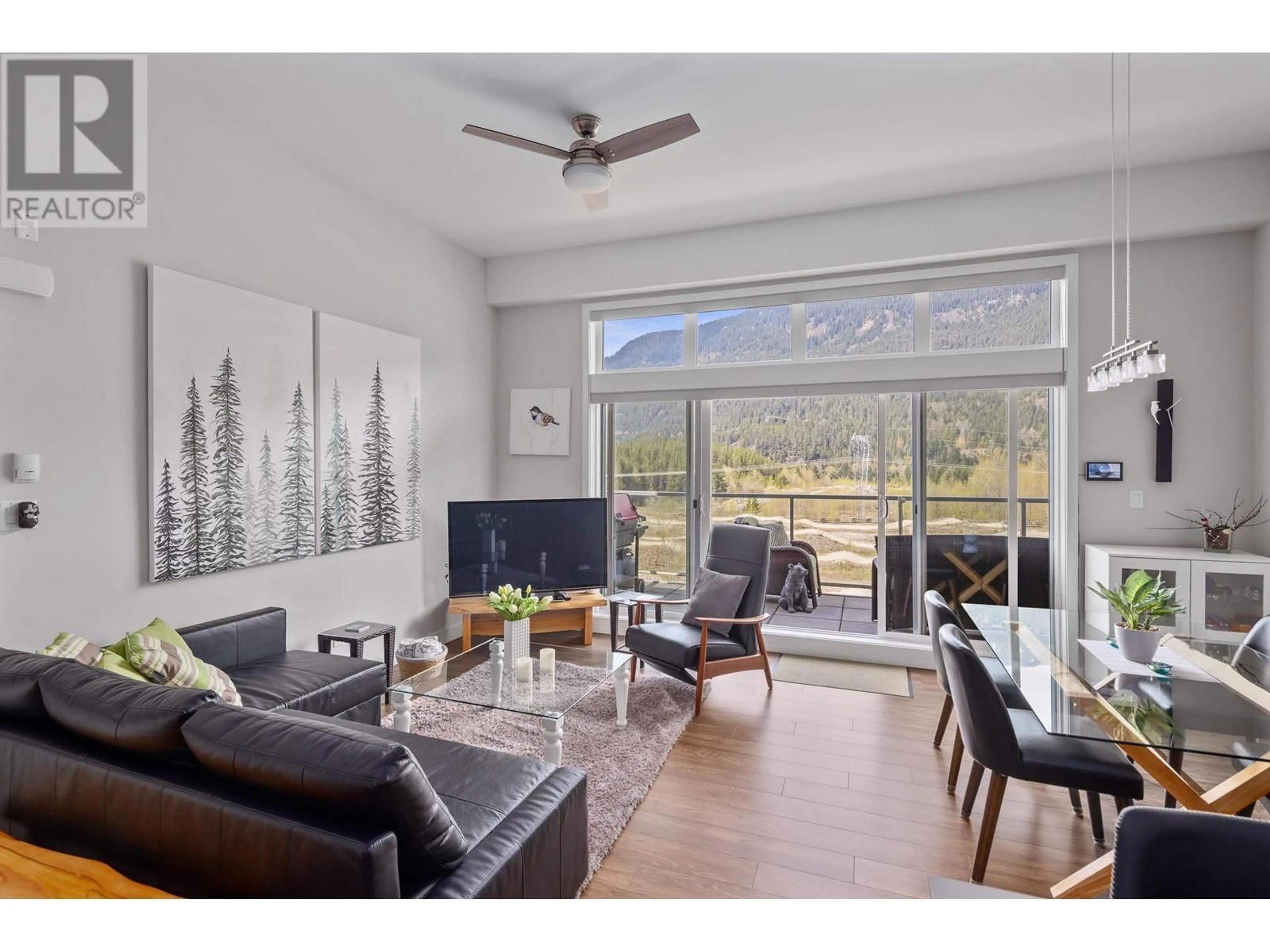 Living room with furniture, wood/laminate floor for 306 - 1025 LEGACY WAY, Whistler British Columbia V8E0S2