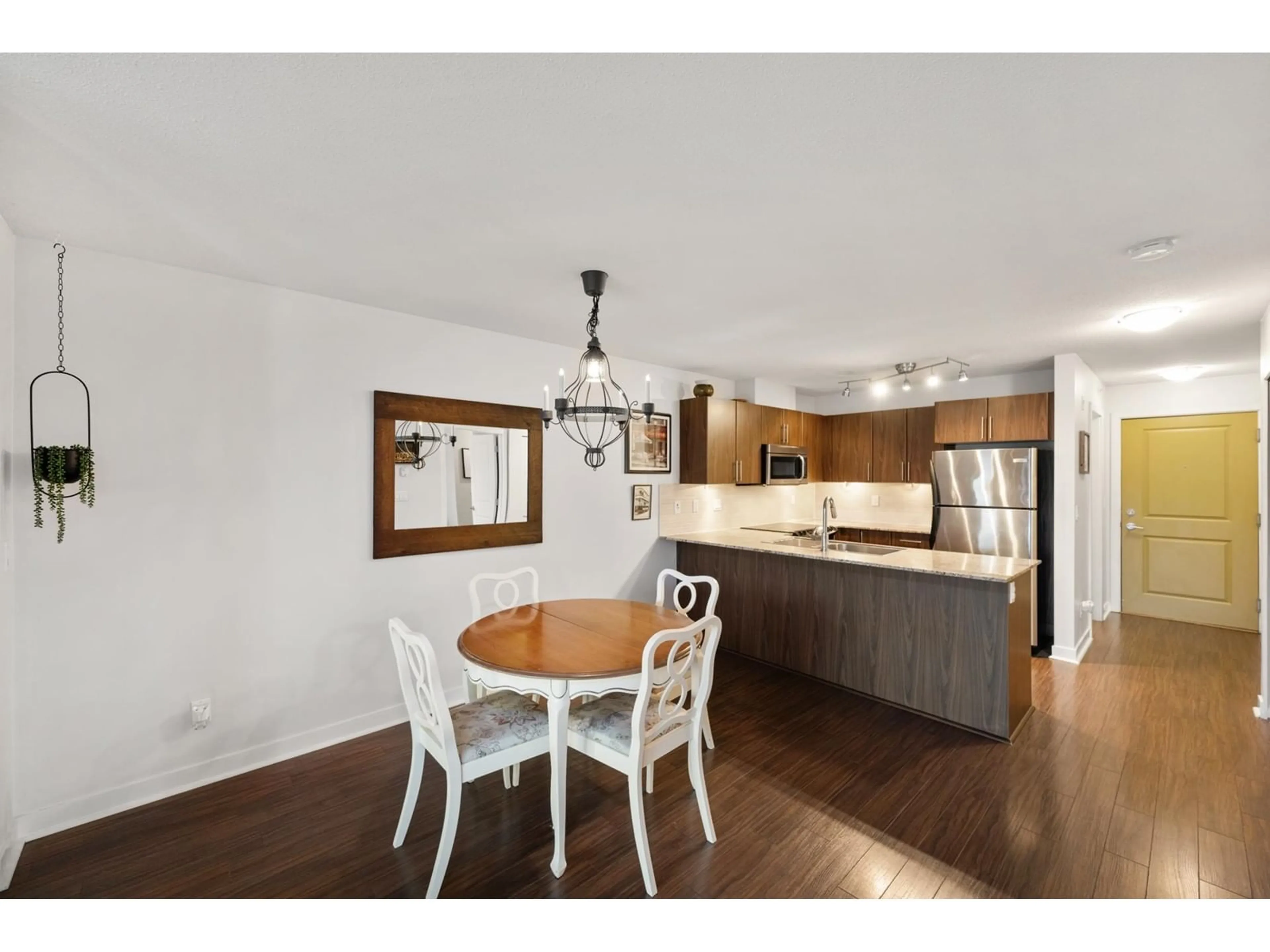 Open concept kitchen, wood/laminate floor for A412 - 8929 202, Langley British Columbia V1M0B4