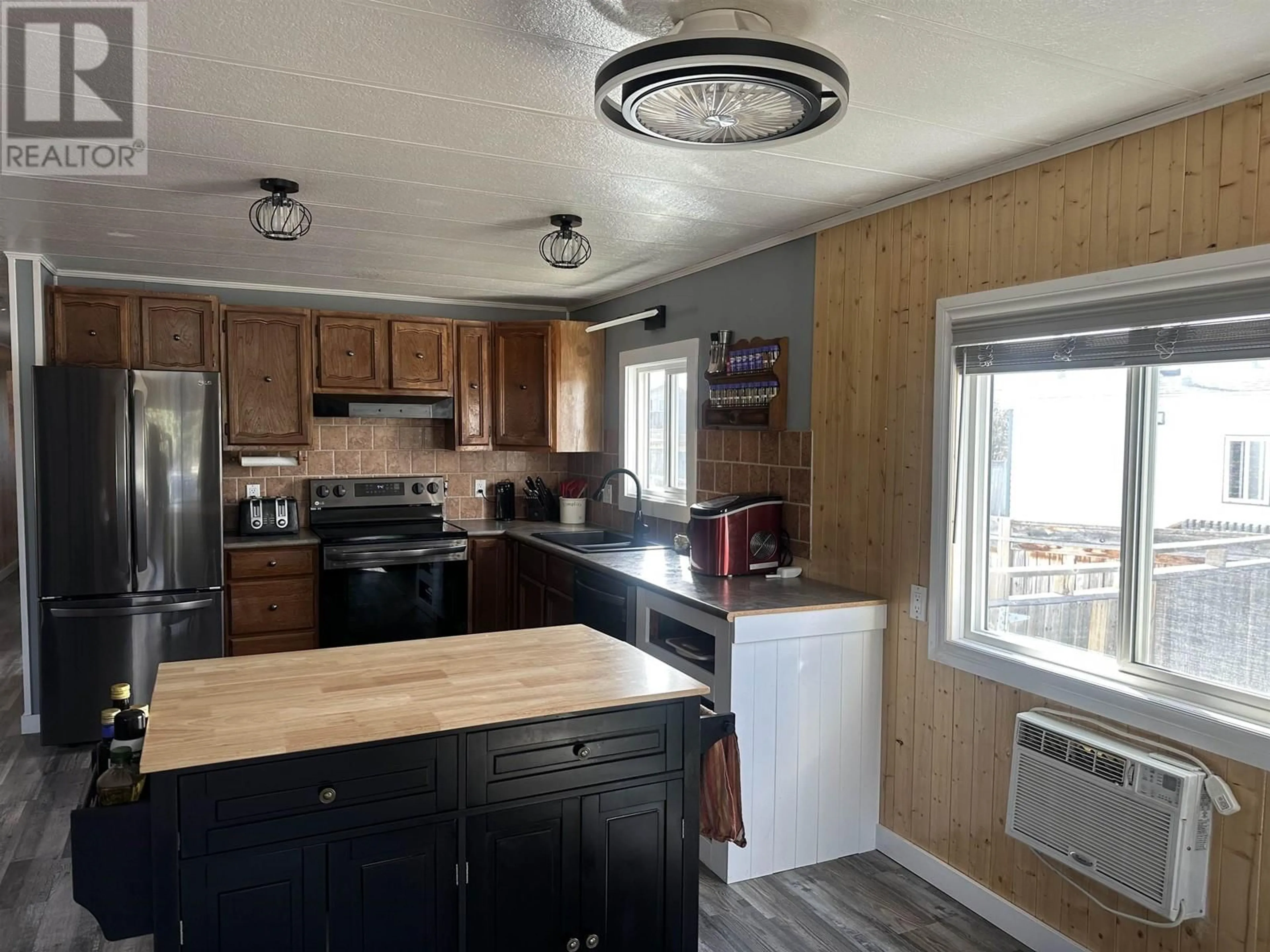 Standard kitchen, wood/laminate floor for 8723 75 STREET, Fort St. John British Columbia V1J2Y9