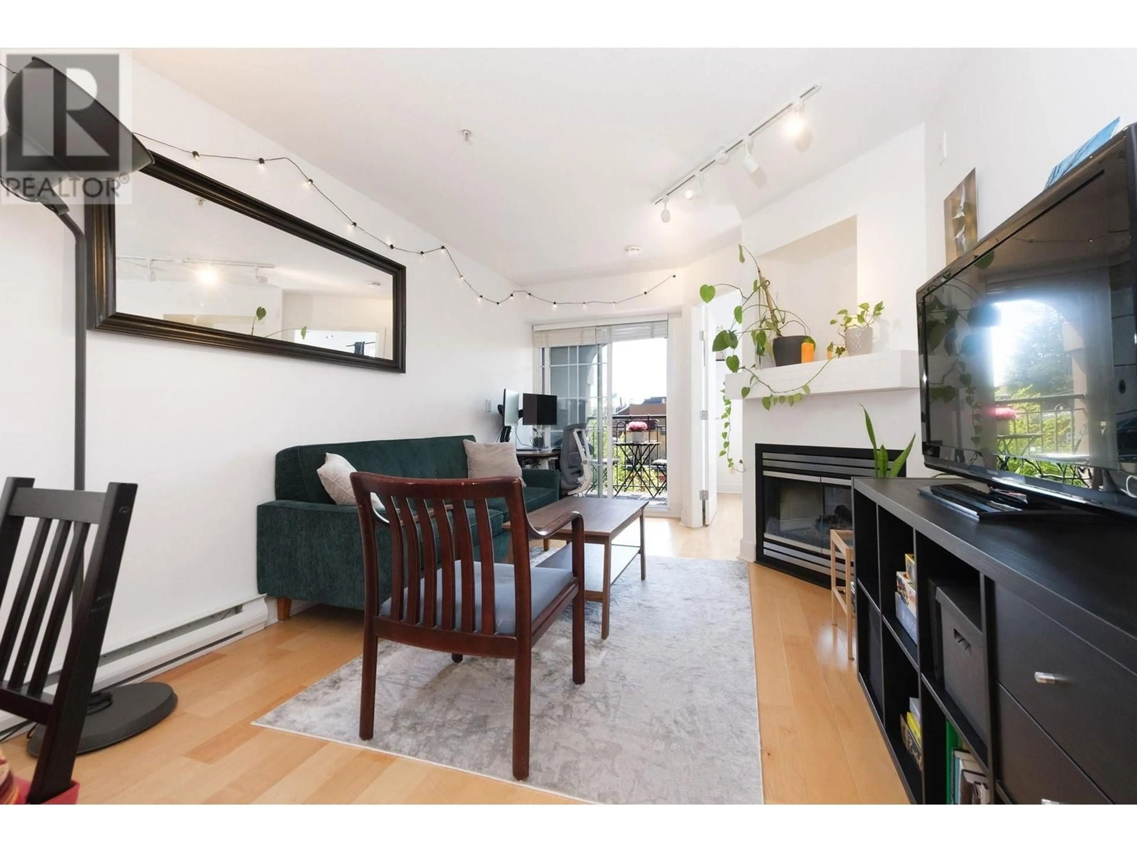 Living room with furniture, wood/laminate floor for 406 - 1989 DUNBAR STREET, Vancouver British Columbia V6R4R5