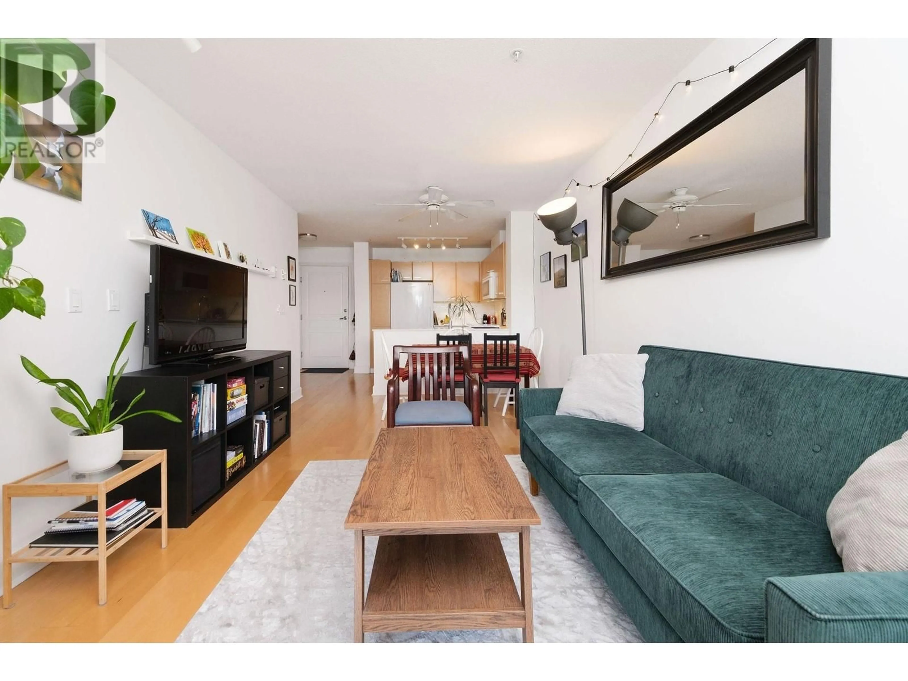 Living room with furniture, wood/laminate floor for 406 - 1989 DUNBAR STREET, Vancouver British Columbia V6R4R5