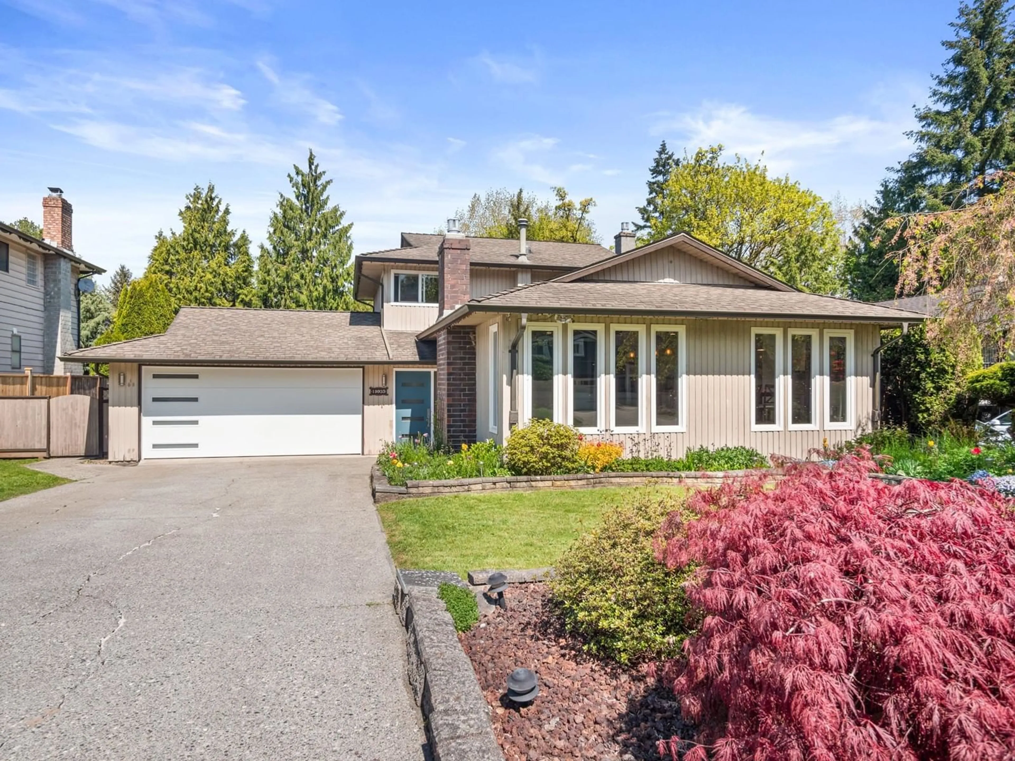 Home with vinyl exterior material, street for 19933 48A, Langley British Columbia V3A6Y1