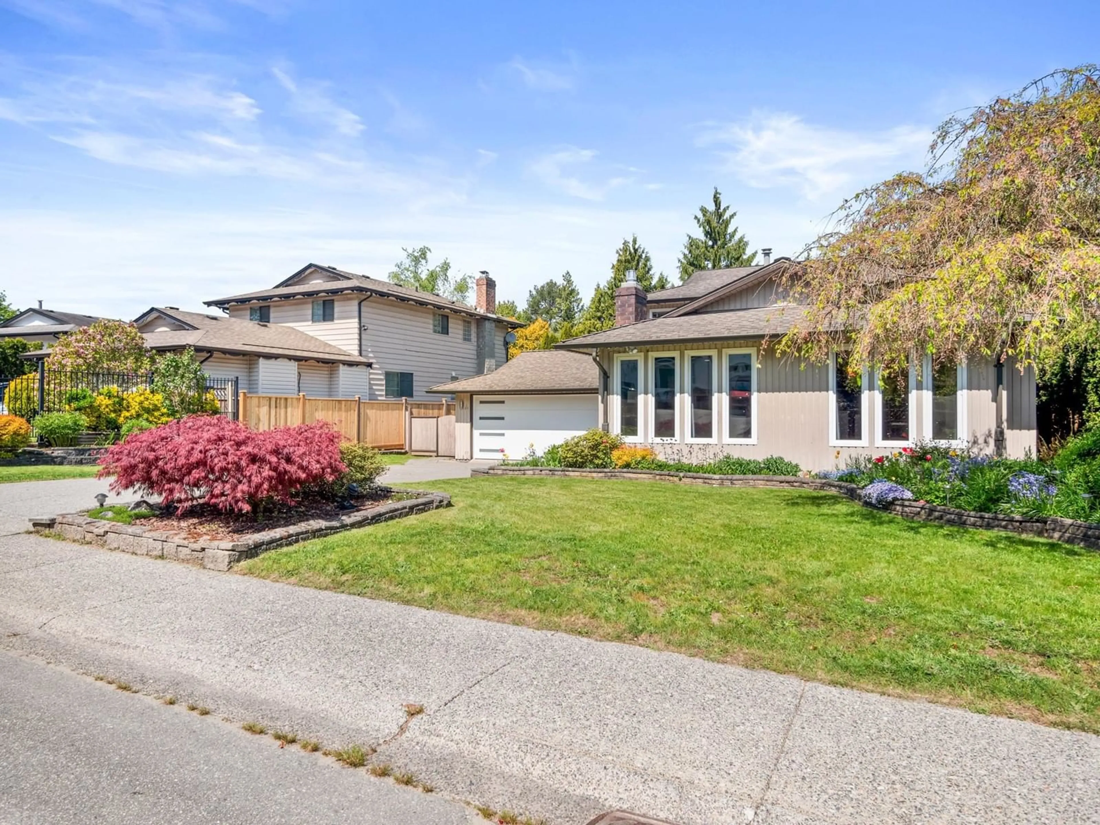 Home with vinyl exterior material, street for 19933 48A, Langley British Columbia V3A6Y1