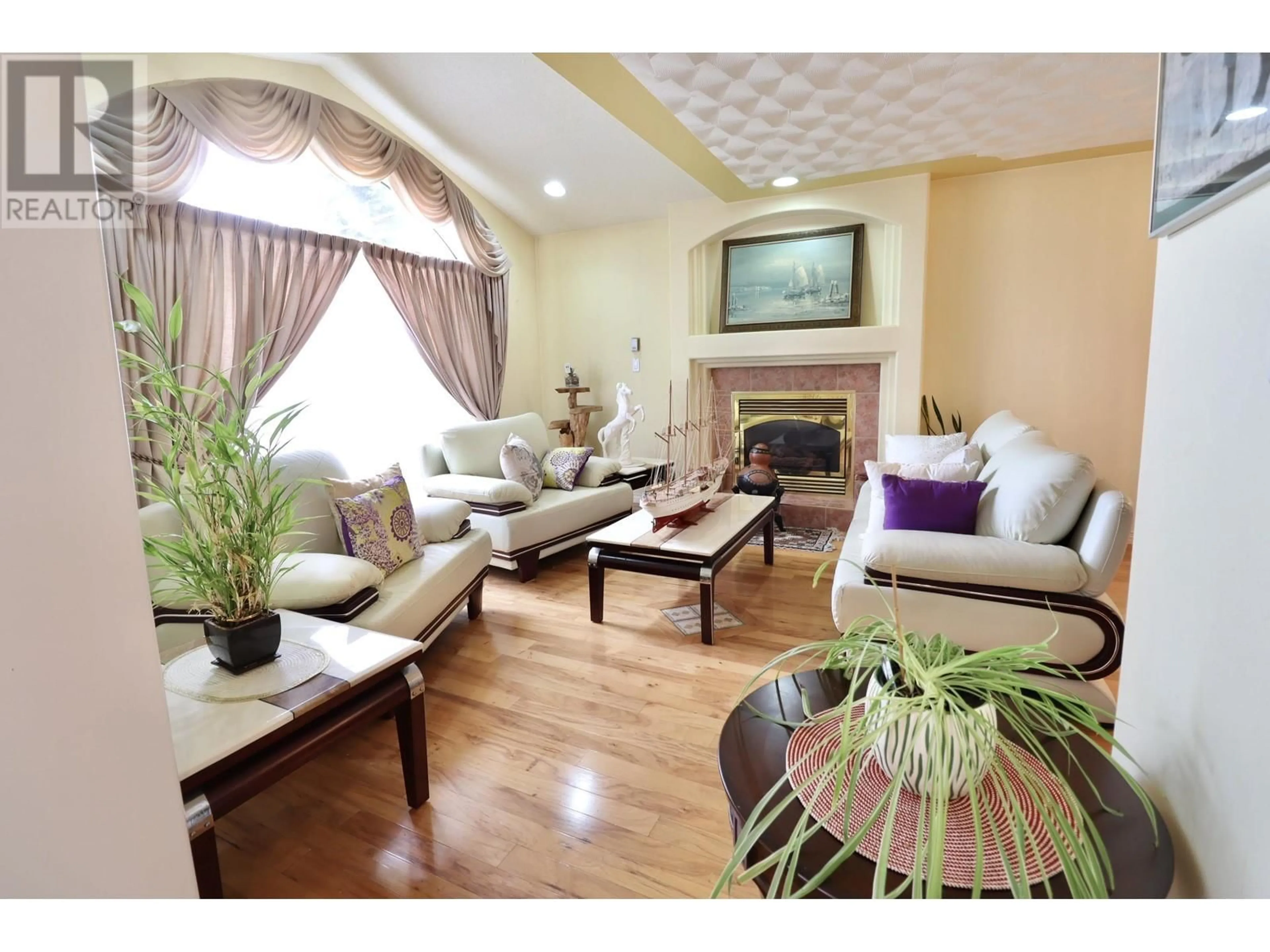 Living room with furniture, wood/laminate floor for 4545 STAUBLE ROAD, Prince George British Columbia V2K4W9