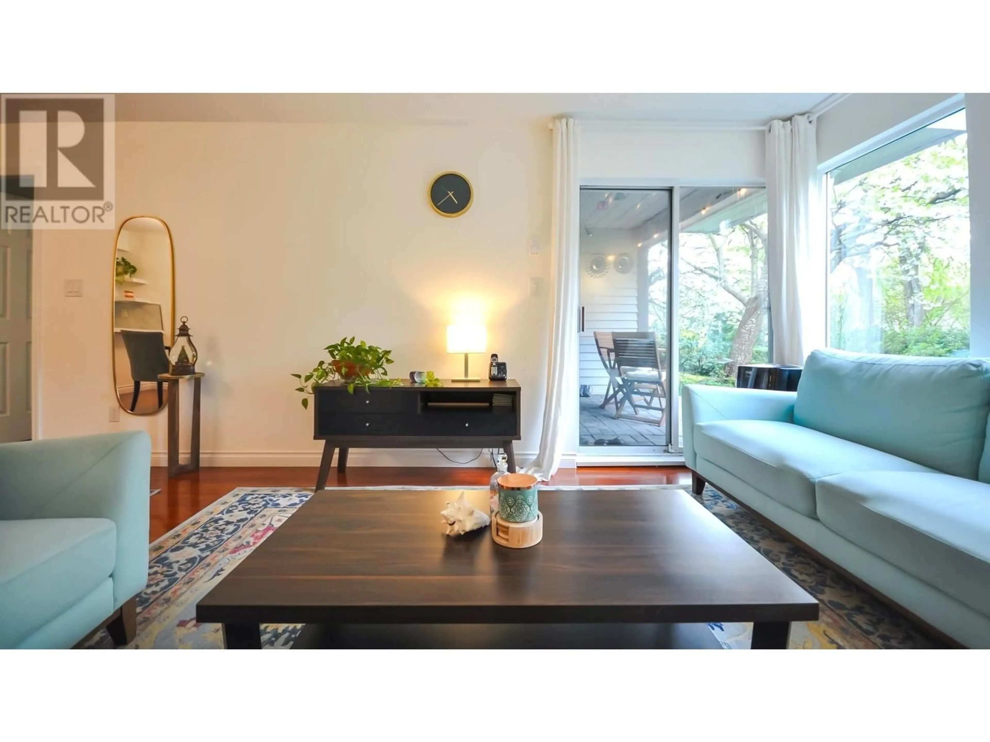 Living room with furniture, wood/laminate floor for 109 - 7465 SANDBORNE AVENUE, Burnaby British Columbia V3N4W7