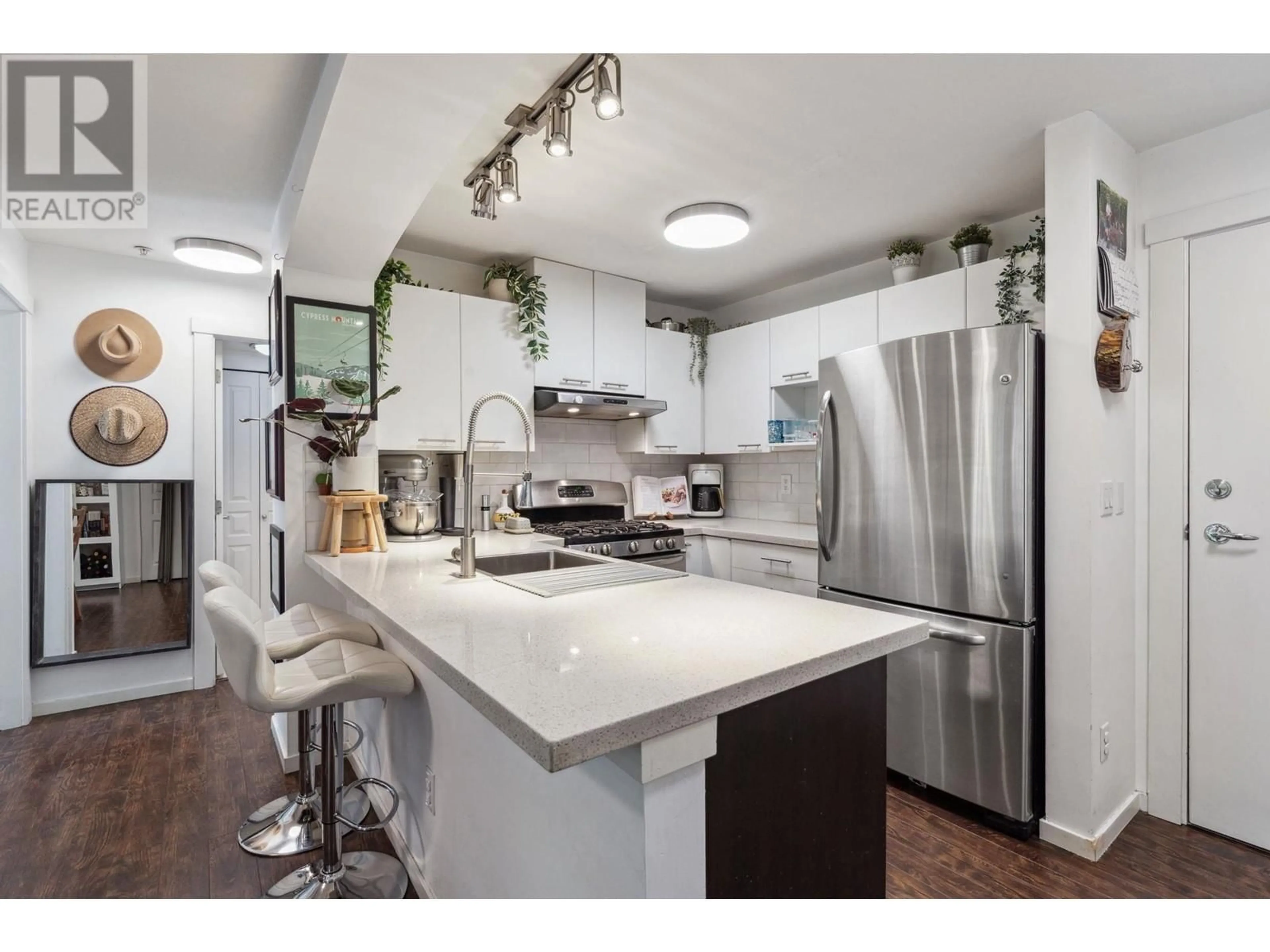 Open concept kitchen, ceramic/tile floor for 205 - 9319 UNIVERSITY CRESCENT, Burnaby British Columbia V5A4Y5