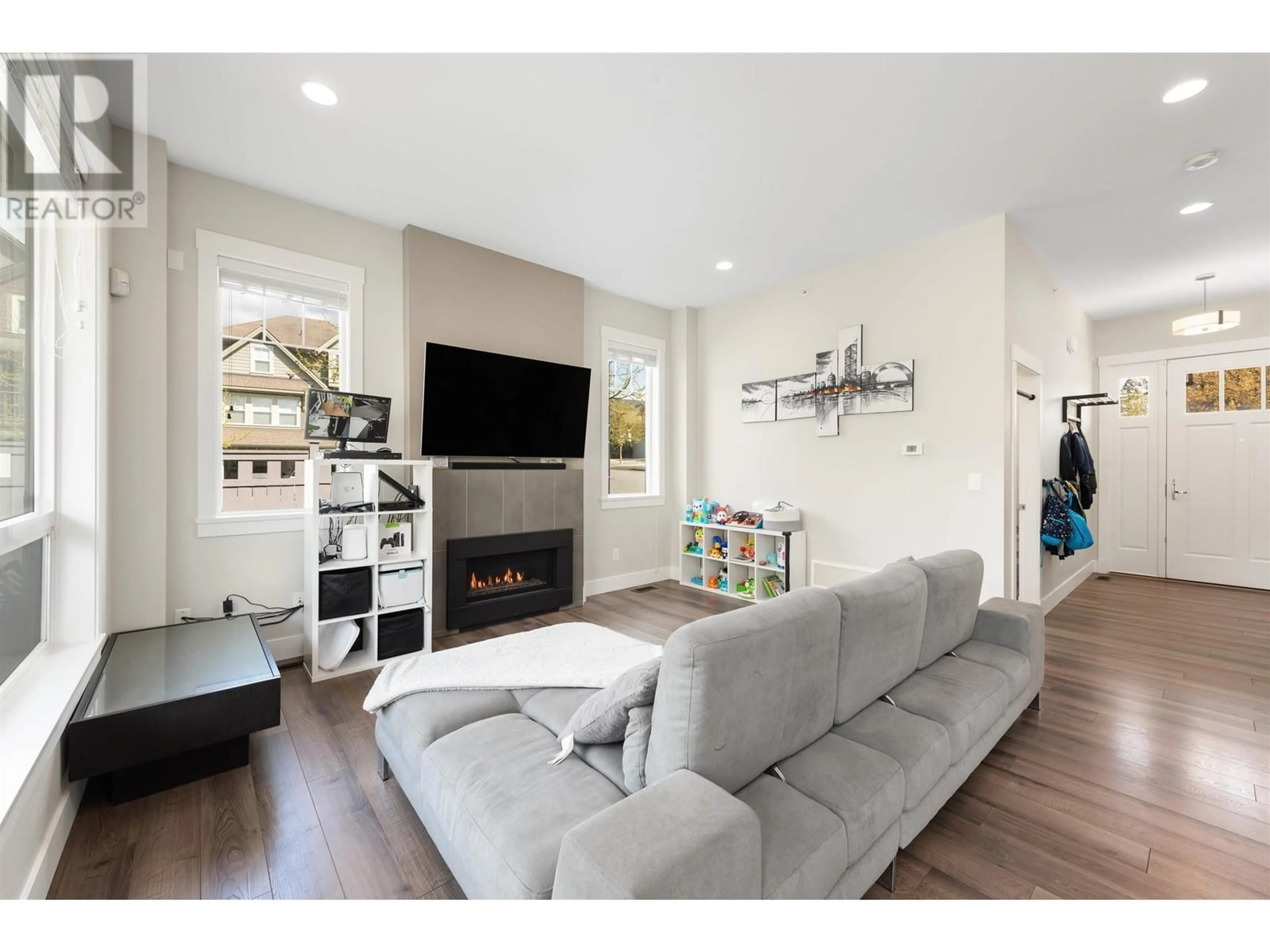 Living room with furniture, wood/laminate floor for 23833 110 AVENUE, Maple Ridge British Columbia V2W1Z8