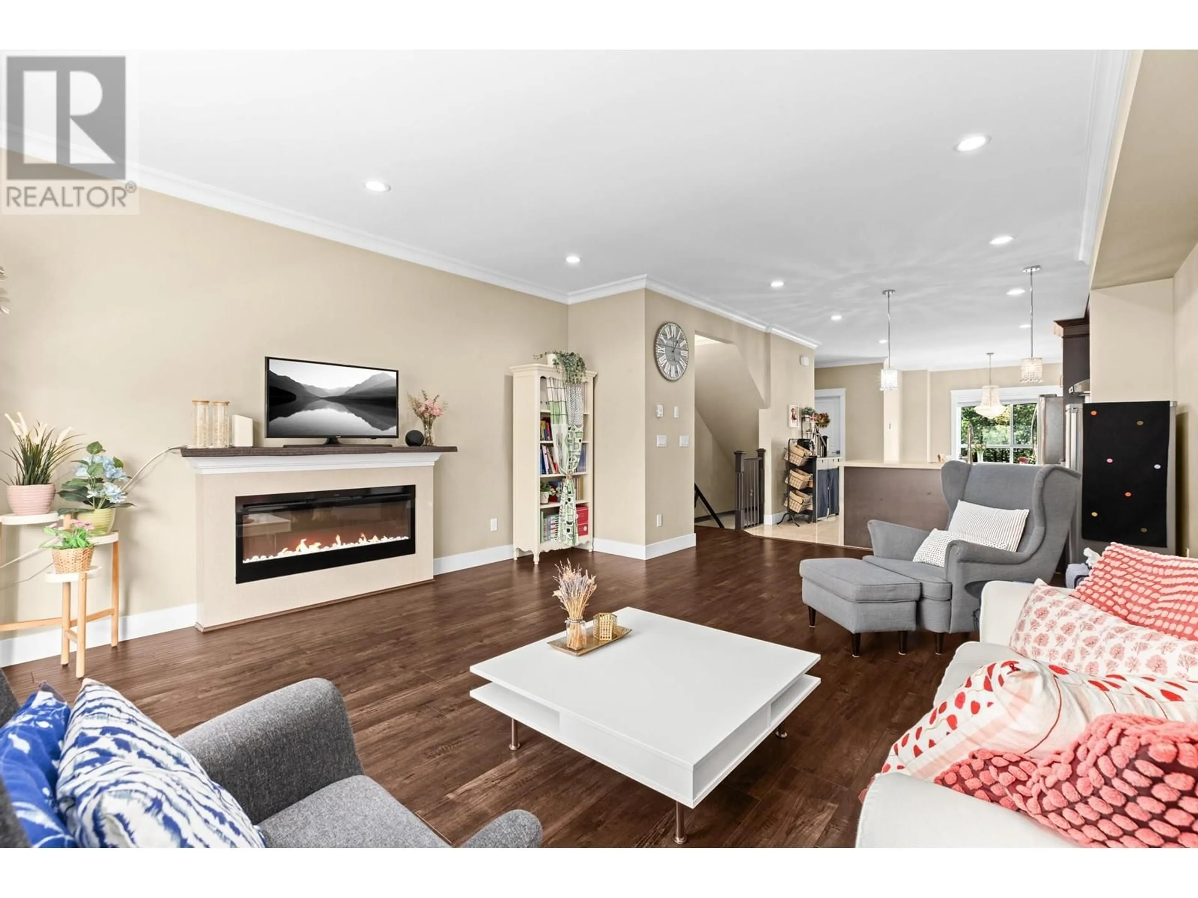 Living room with furniture, wood/laminate floor for 13 - 7551 NO. 2 ROAD, Richmond British Columbia V7C3L7