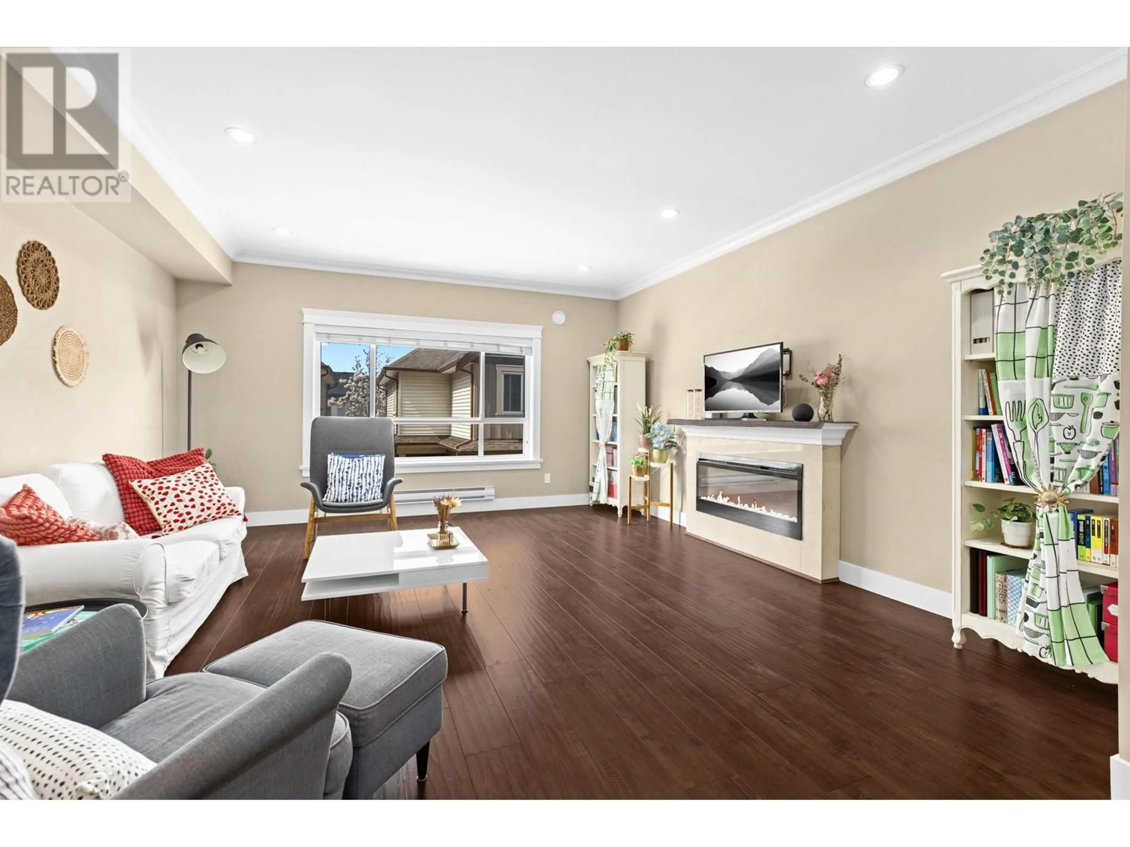 Living room with furniture, wood/laminate floor for 13 - 7551 NO. 2 ROAD, Richmond British Columbia V7C3L7