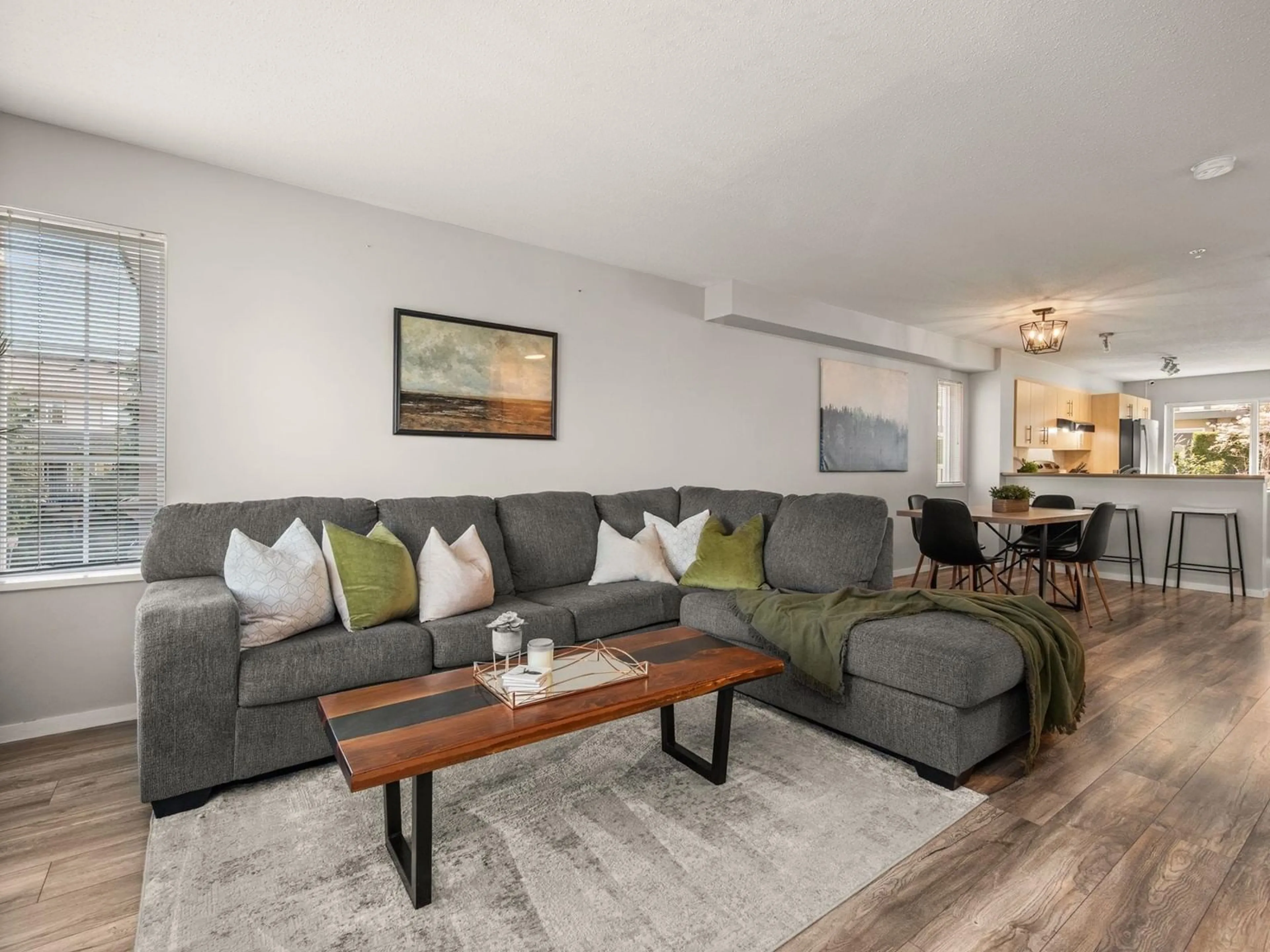 Living room with furniture, wood/laminate floor for 115 - 20875 80, Langley British Columbia V2Y0B2