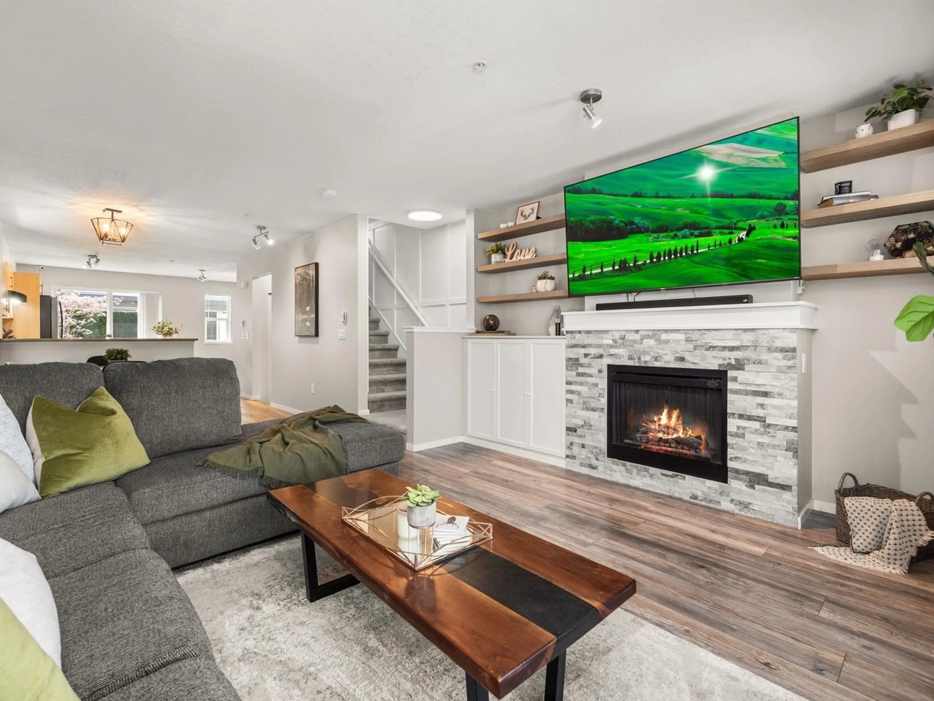 Living room with furniture, wood/laminate floor for 115 - 20875 80, Langley British Columbia V2Y0B2