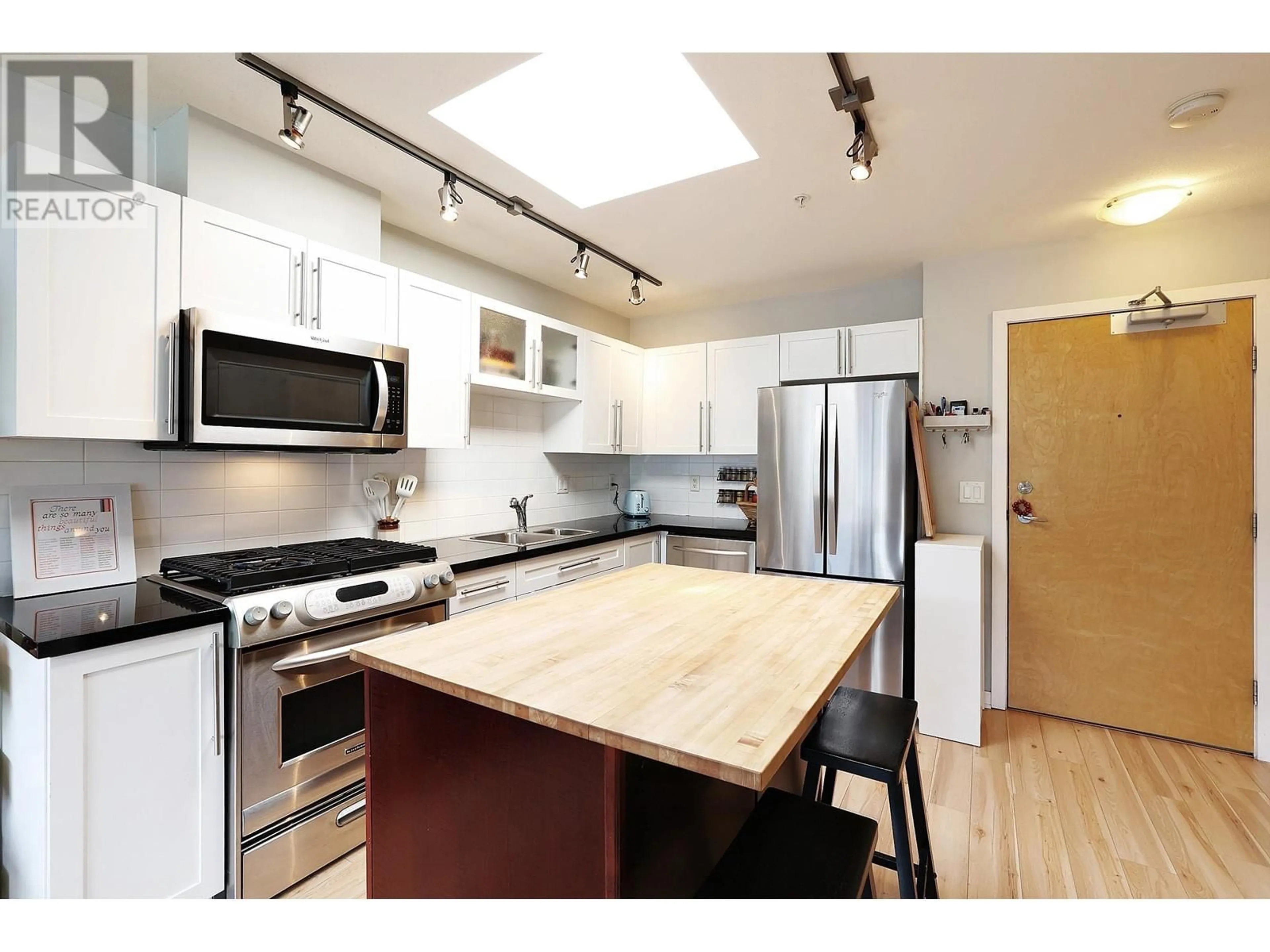 Open concept kitchen, wood/laminate floor for 504 - 122 3RD STREET, North Vancouver British Columbia V7L1E6