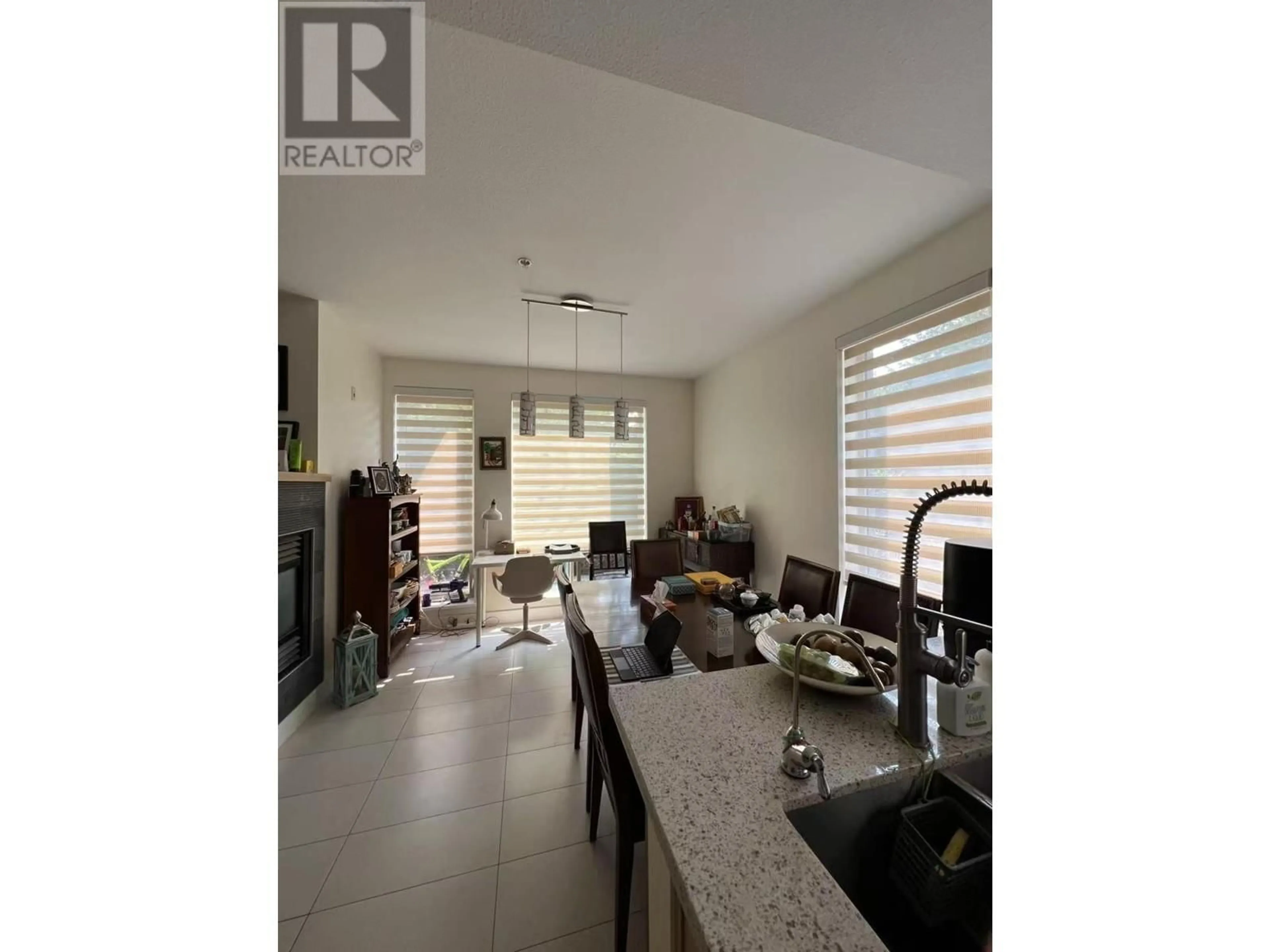 Open concept kitchen, ceramic/tile floor for 122 - 5777 BIRNEY AVENUE, Vancouver British Columbia V6S0A4