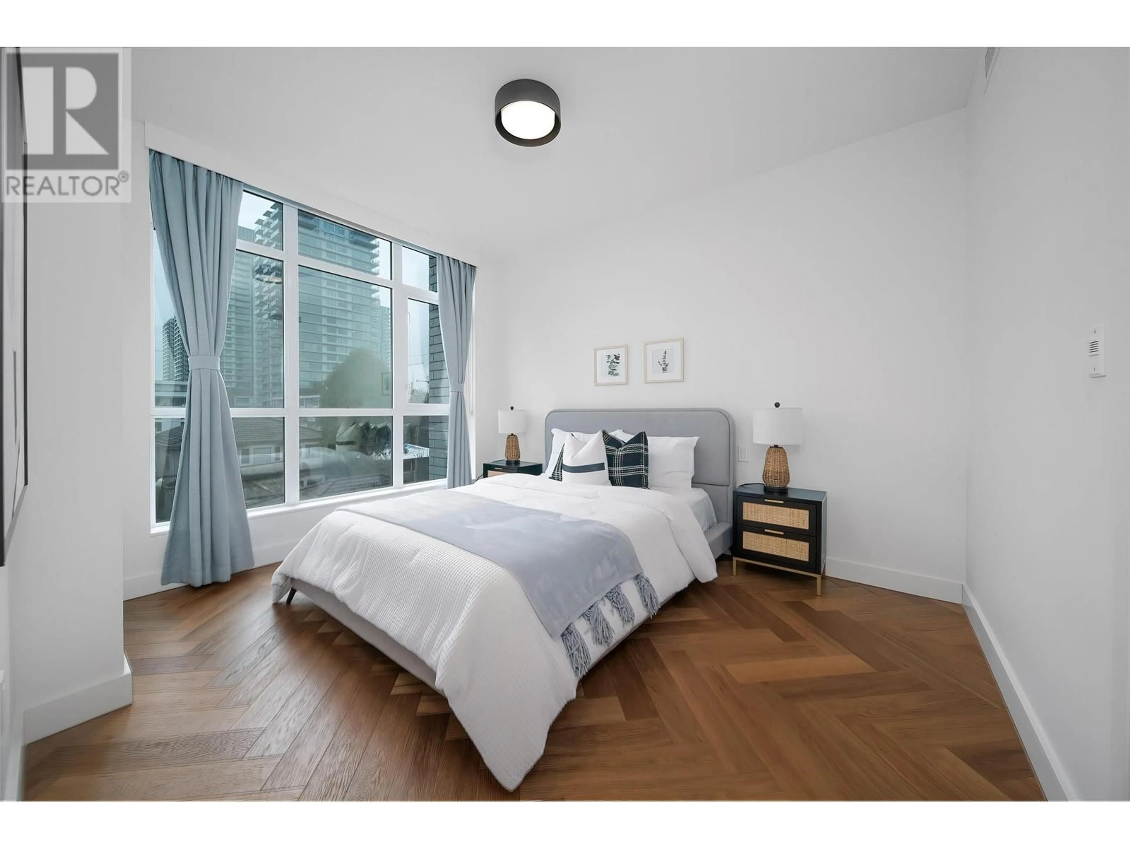 Bedroom with bed, wood/laminate floor for 305 - 458 63RD AVENUE, Vancouver British Columbia V5X2J4
