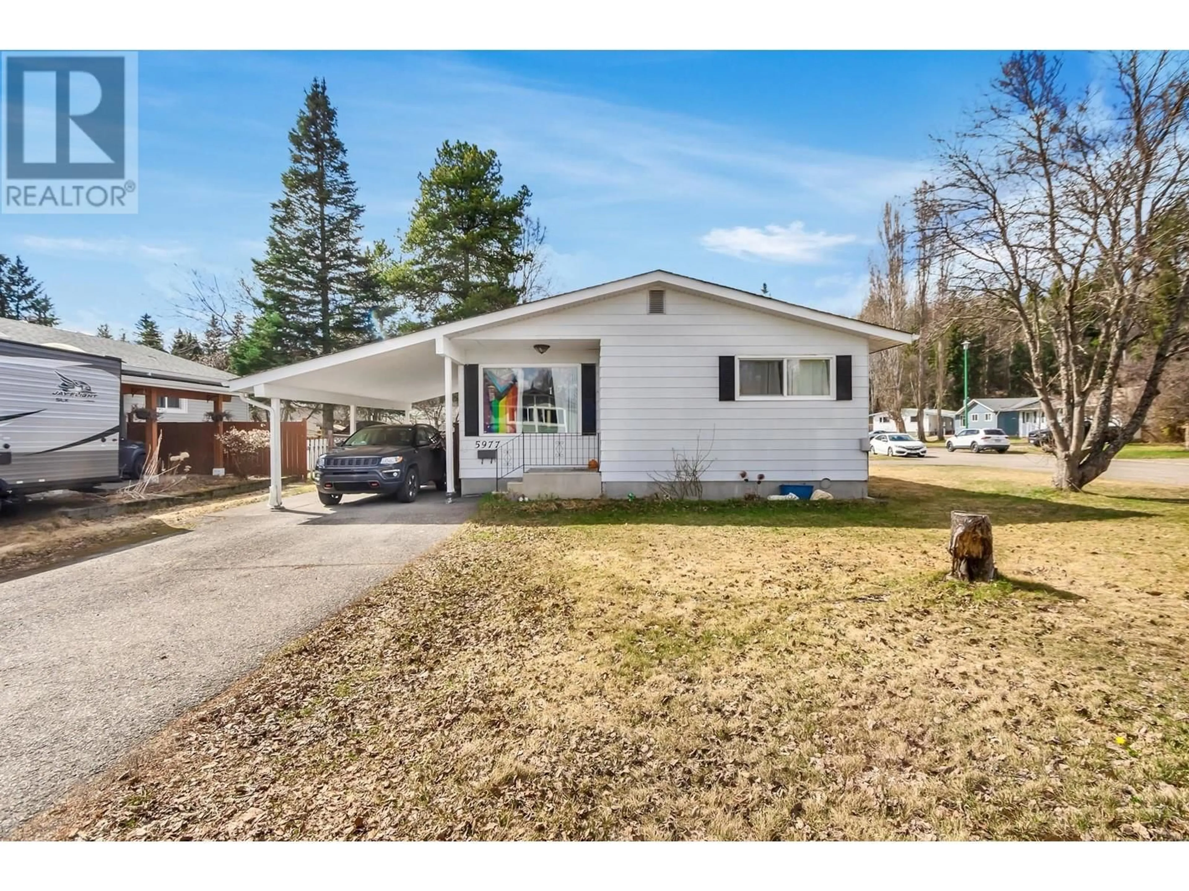 Home with vinyl exterior material, street for 5977 SIMON FRASER AVENUE, Prince George British Columbia V2N2C7