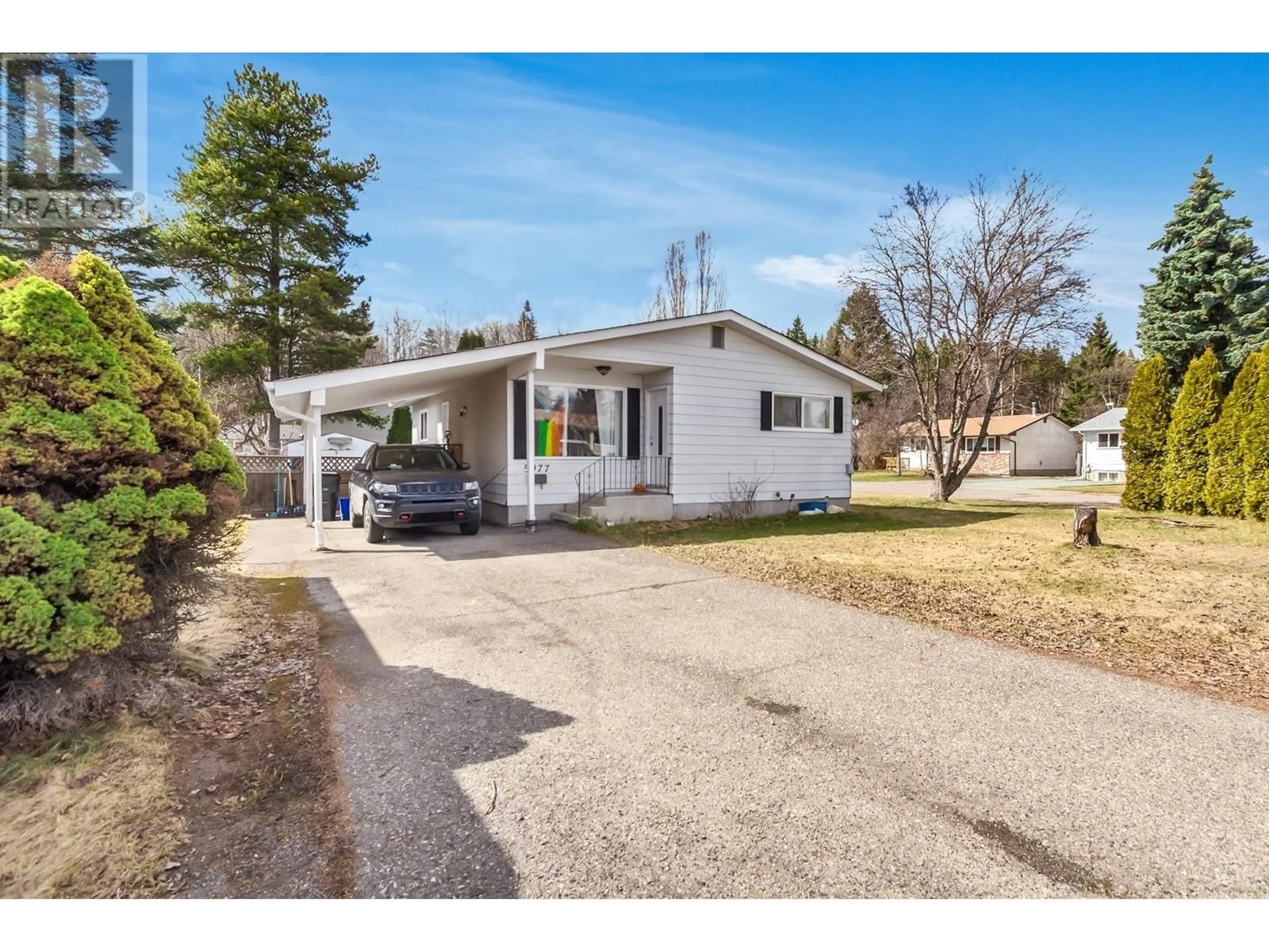 Home with vinyl exterior material, street for 5977 SIMON FRASER AVENUE, Prince George British Columbia V2N2C7
