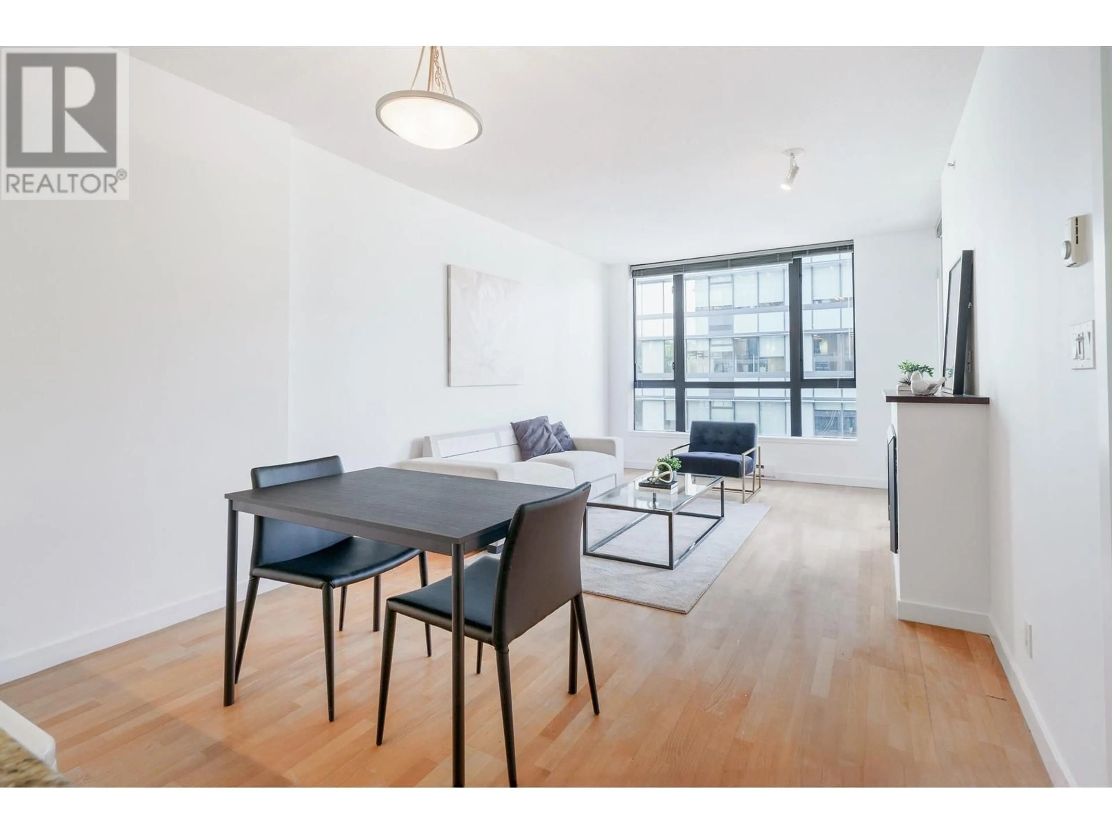 Living room with furniture, wood/laminate floor for 501 - 400 CAPILANO ROAD, Port Moody British Columbia V3H0E1