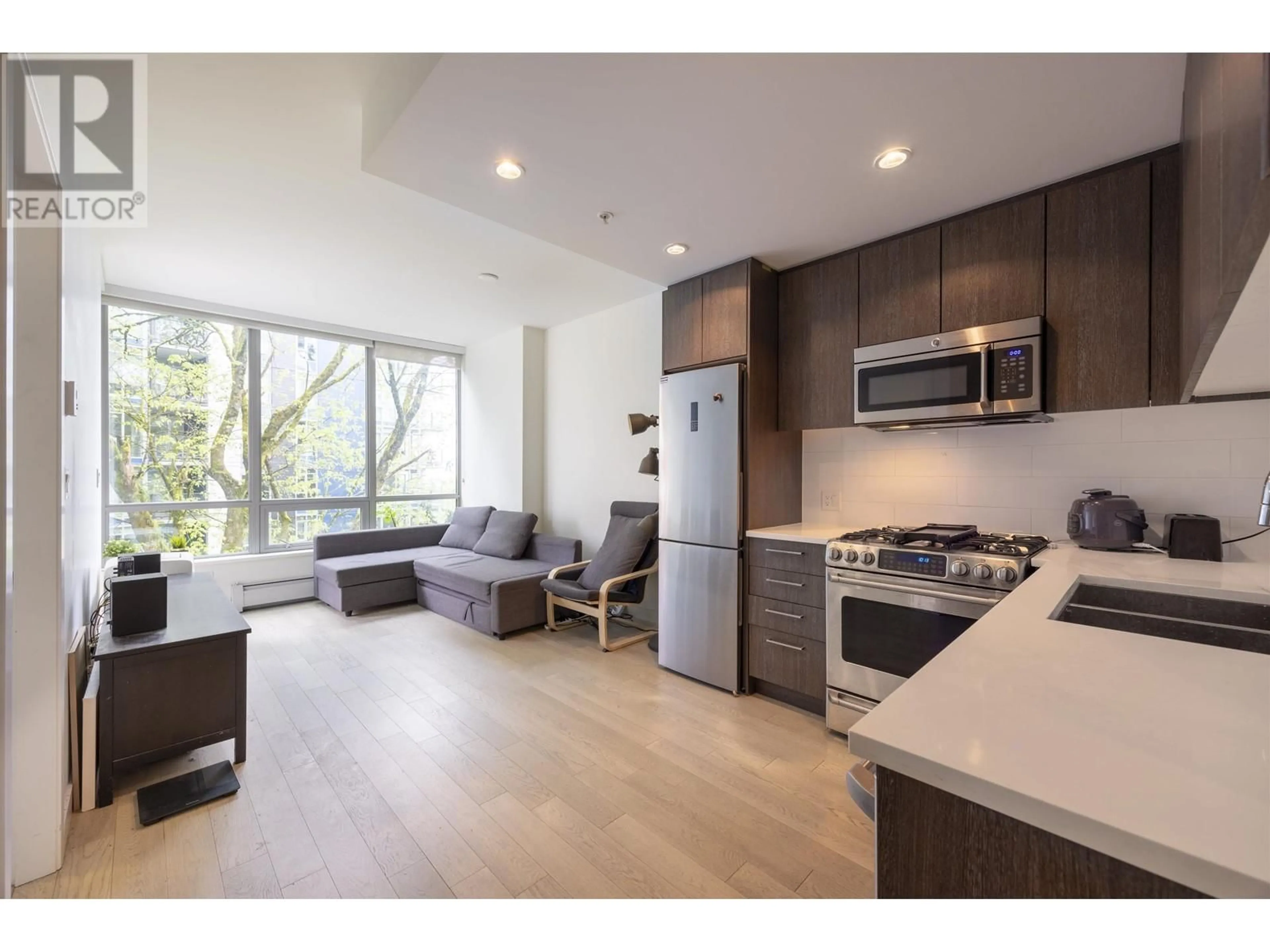 Open concept kitchen, wood/laminate floor for 305 - 9060 UNIVERSITY CRESCENT, Burnaby British Columbia V5A0E1
