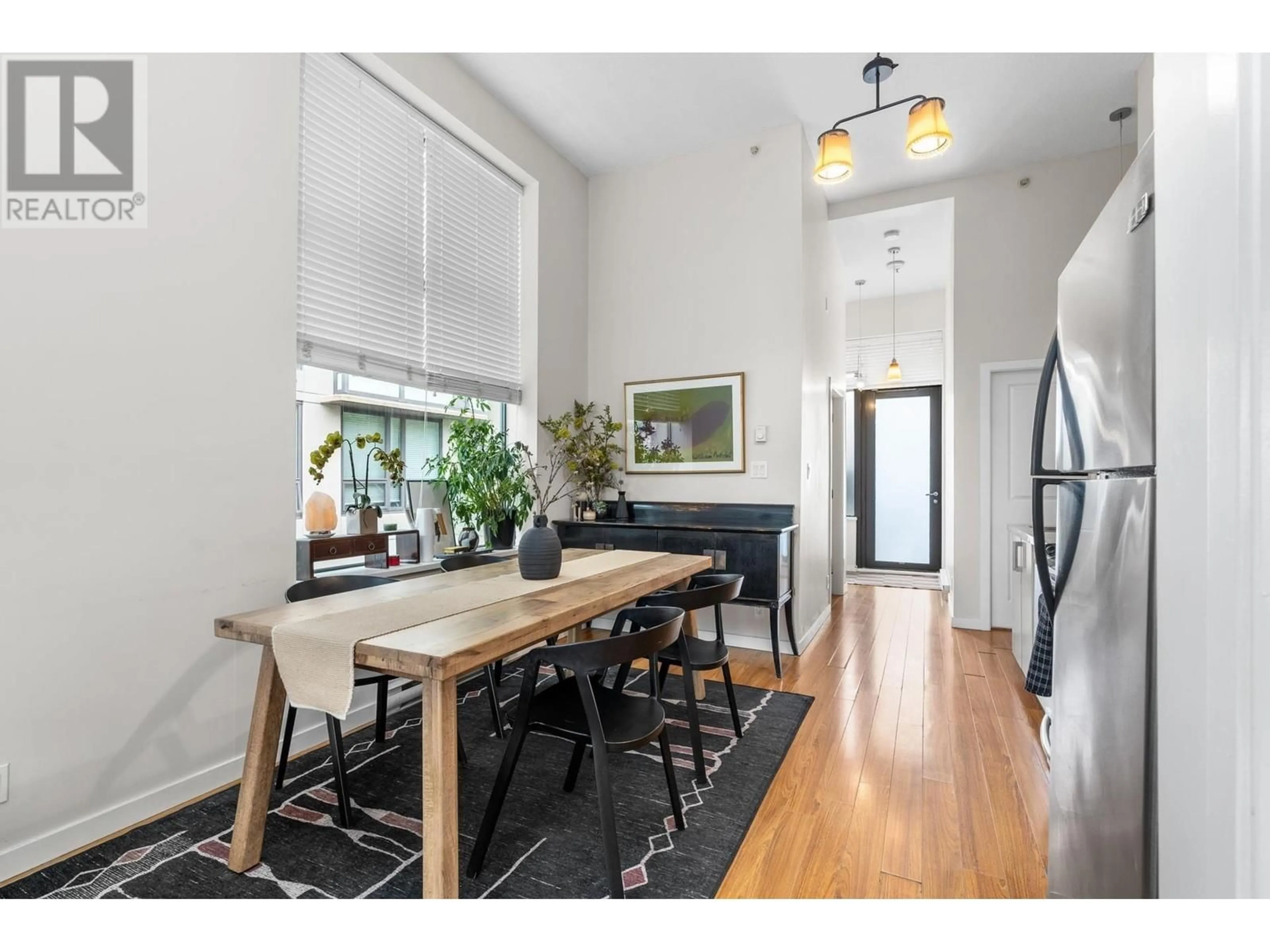 Dining room, wood/laminate floor for 203 - 1068 BROADWAY, Vancouver British Columbia V6H0A7