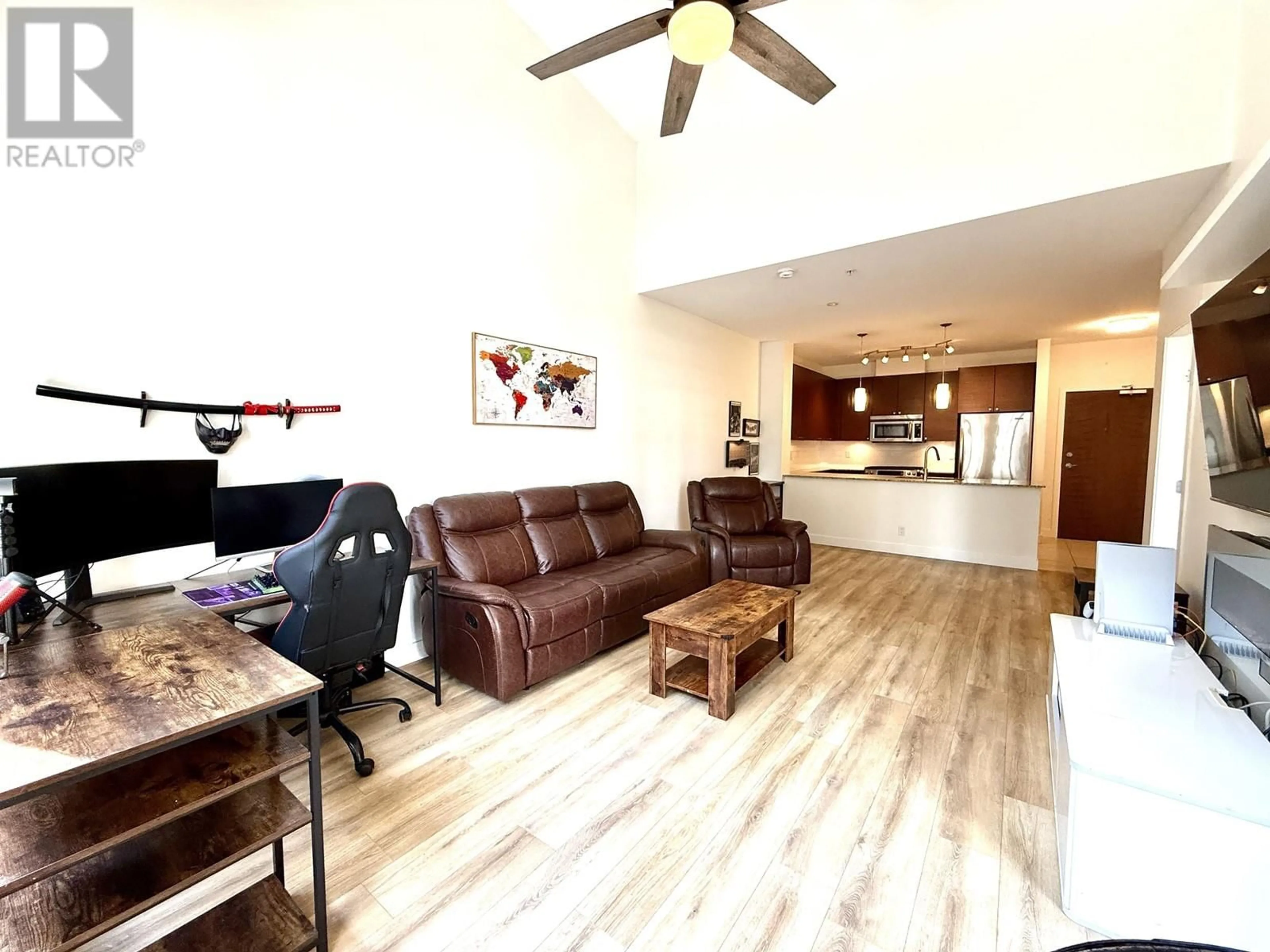 Living room with furniture, wood/laminate floor for 419 - 101 MORRISSEY ROAD, Port Moody British Columbia V3H0E6