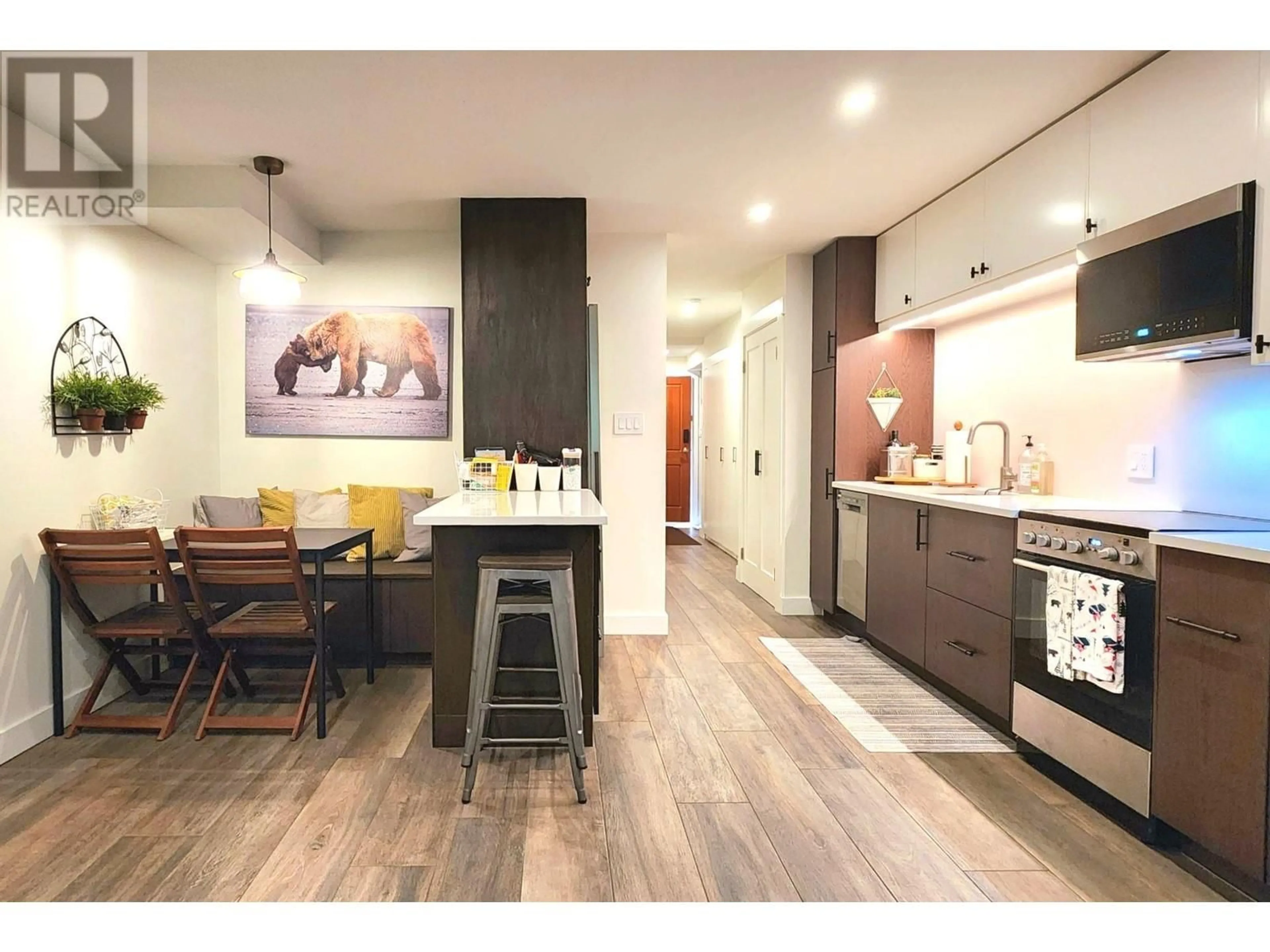 Open concept kitchen, wood/laminate floor for 124 - 3070 HILLCREST DRIVE, Whistler British Columbia V8E0V1