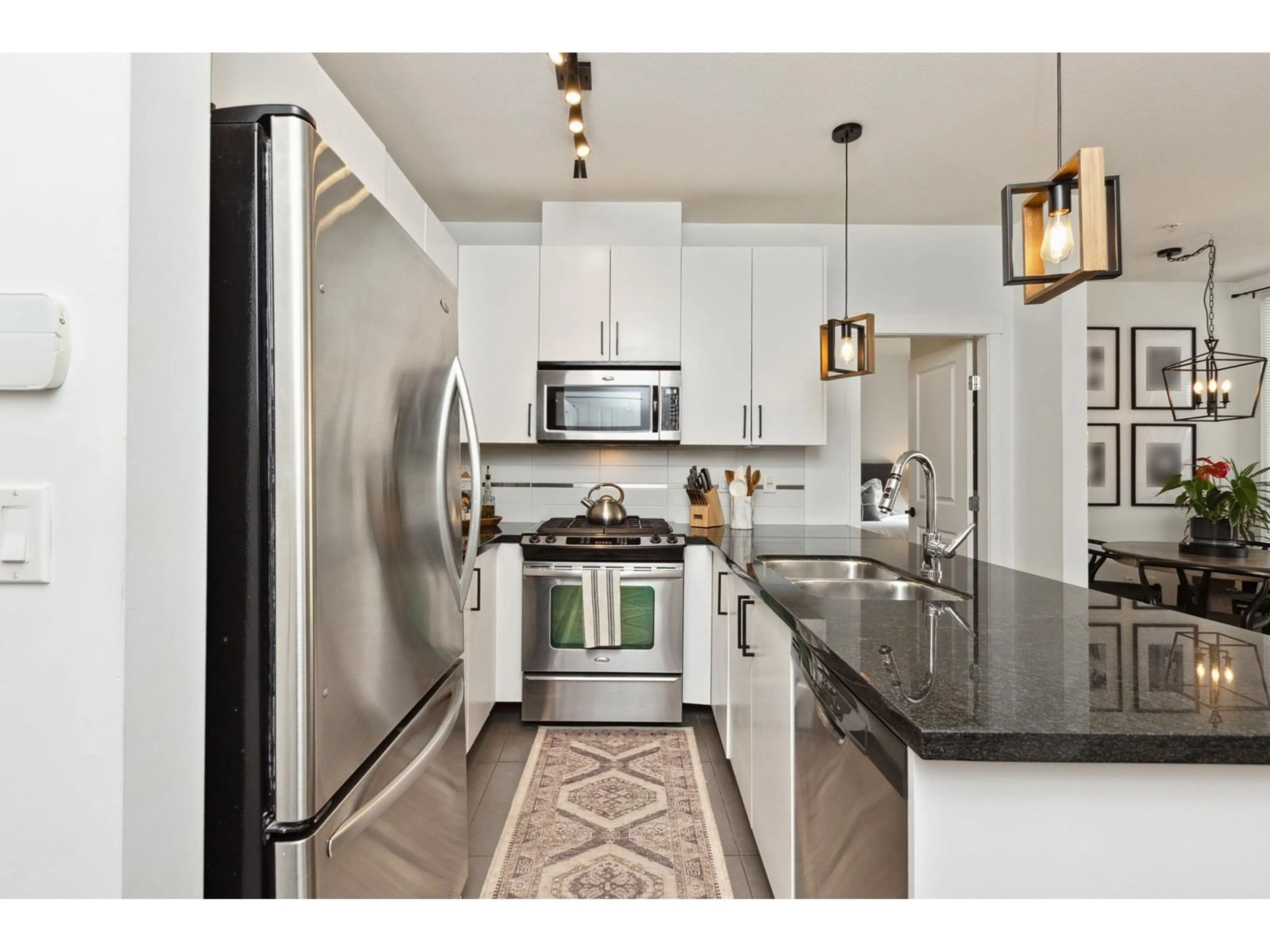 Open concept kitchen, ceramic/tile floor for 132 - 15918 26, Surrey British Columbia V3Z5K3