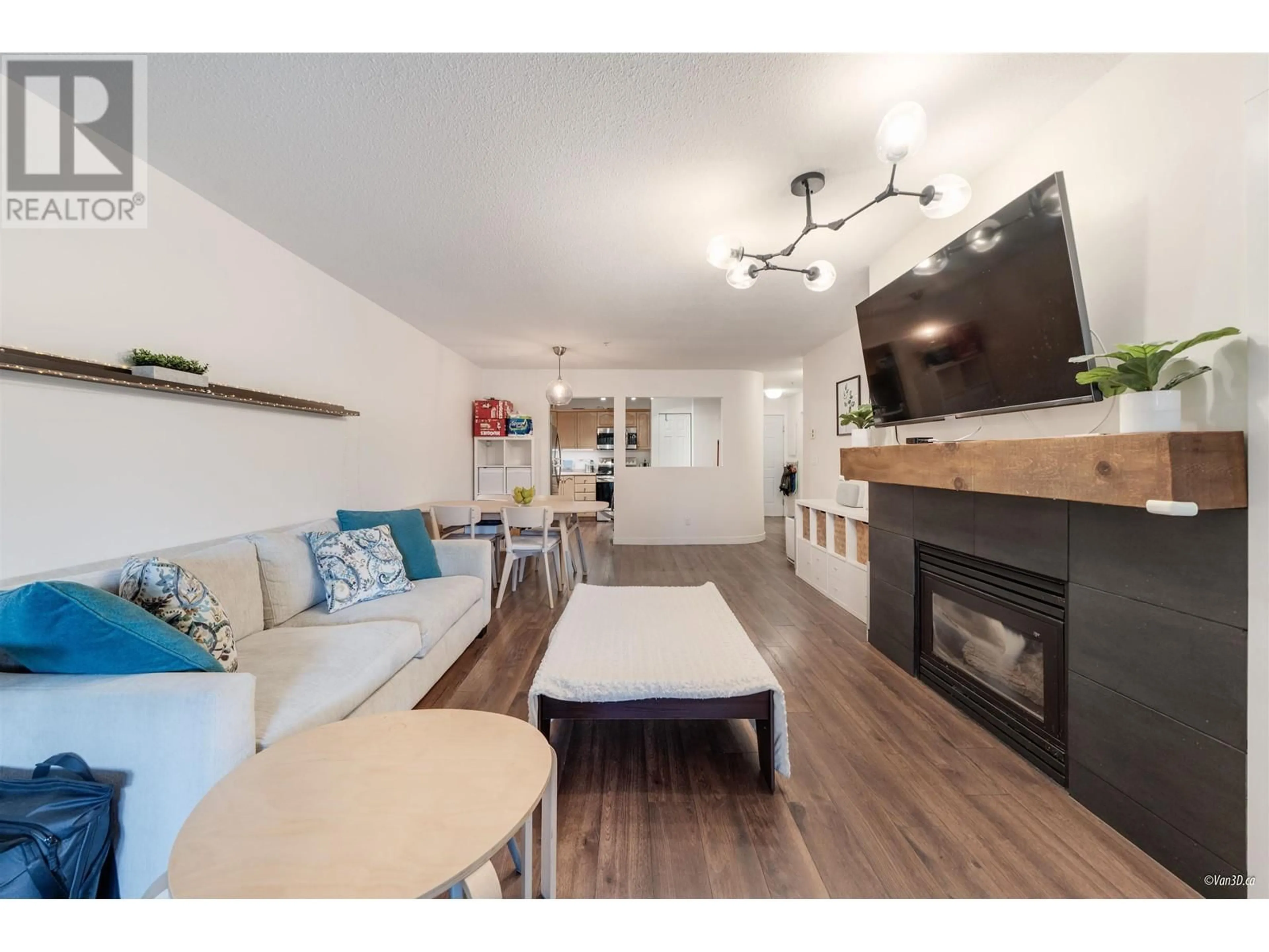 Living room with furniture, wood/laminate floor for 205 - 301 MAUDE ROAD, Port Moody British Columbia V3H5B1