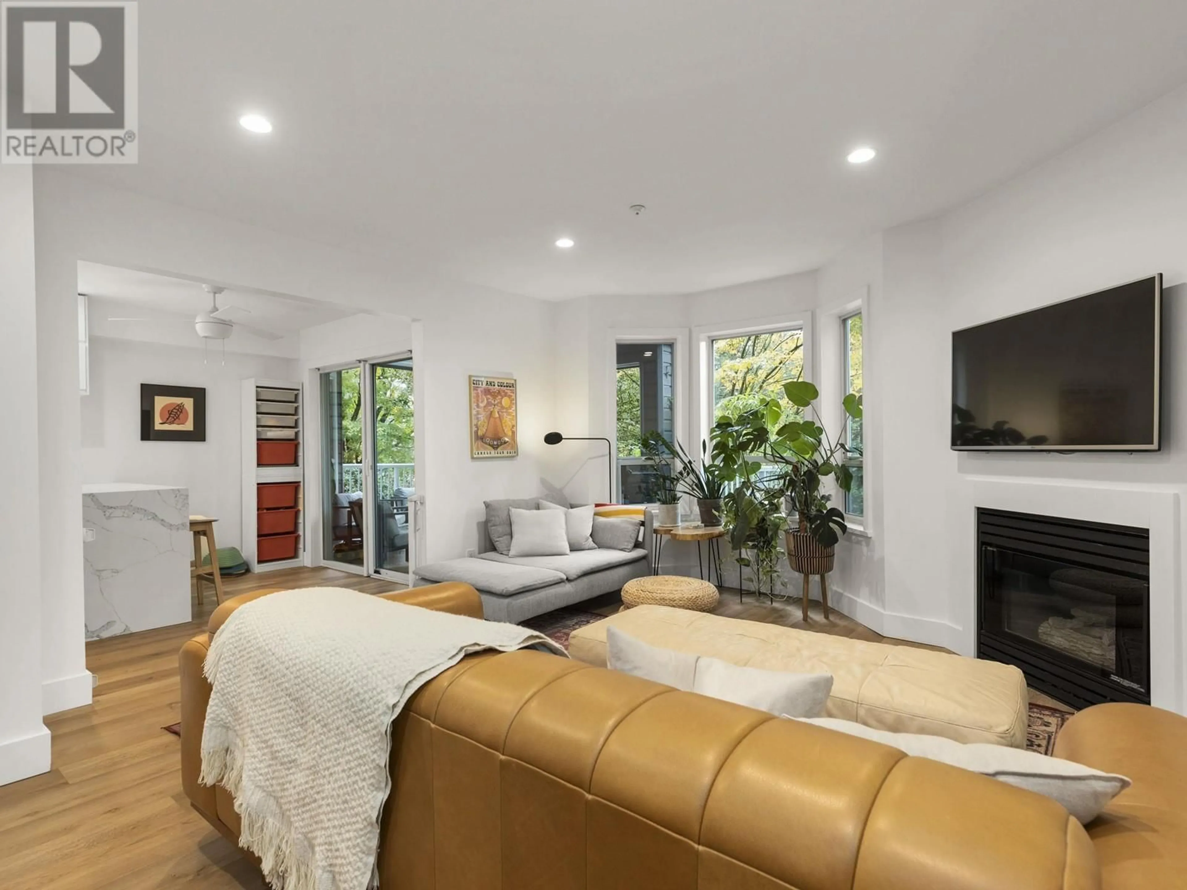 Living room with furniture, unknown for 105 - 1150 LYNN VALLEY ROAD, North Vancouver British Columbia V7J1Z9
