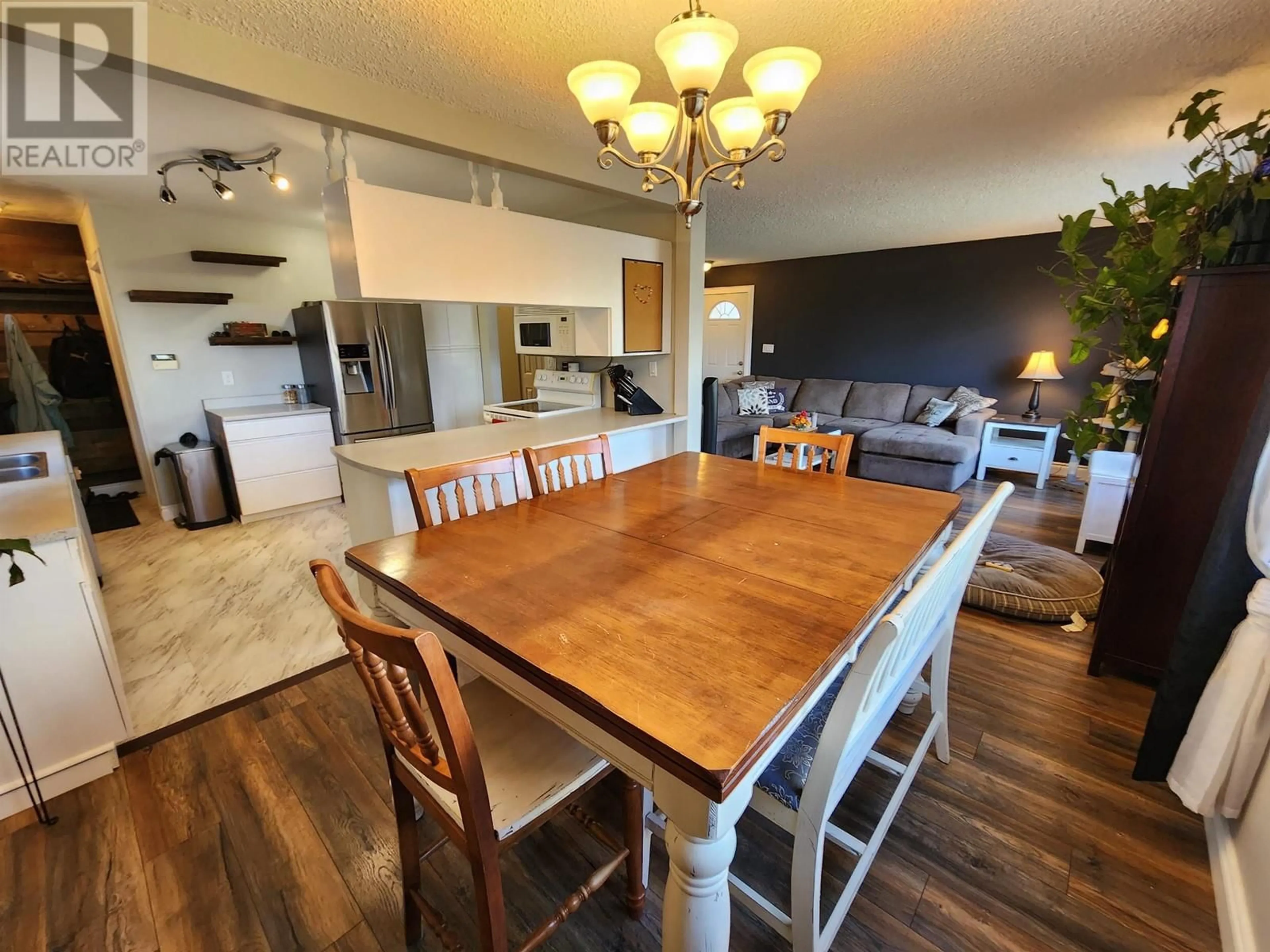 Open concept kitchen, wood/laminate floor for 6151 CALEDONIA CRESCENT, Prince George British Columbia V2N2H5