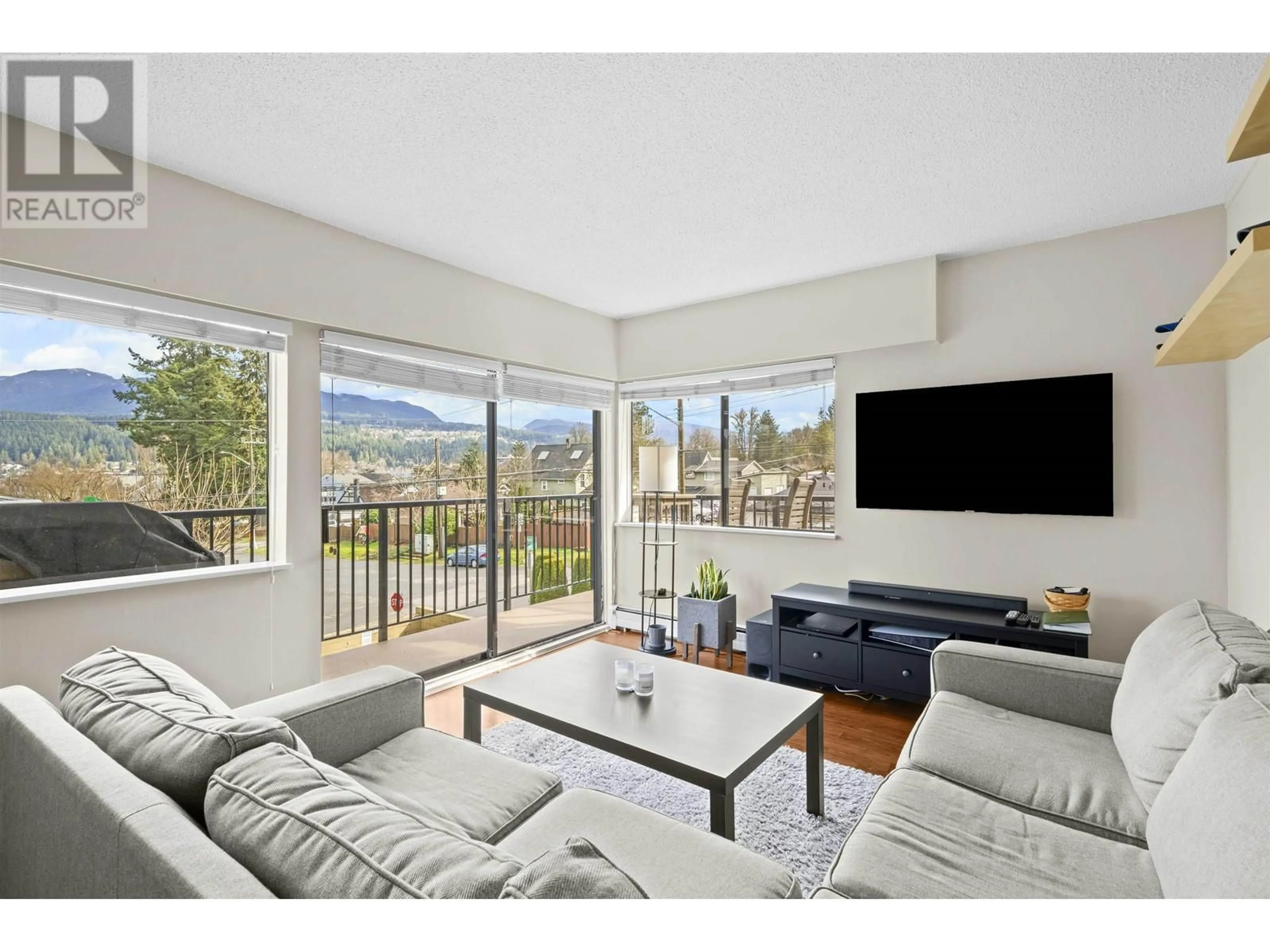 Living room with furniture, wood/laminate floor for 110 - 195 MARY STREET, Port Moody British Columbia V3H2P1