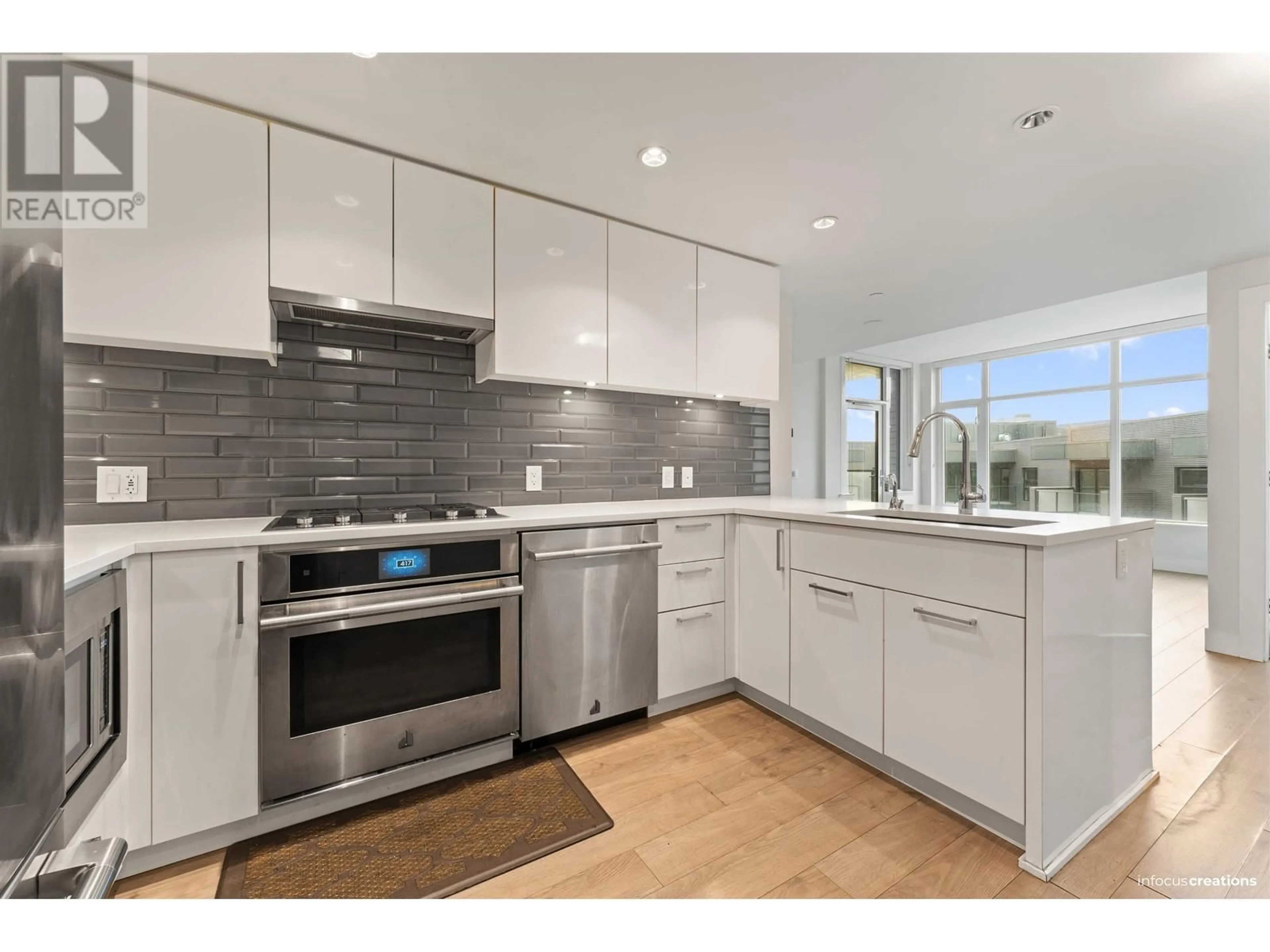 Open concept kitchen, ceramic/tile floor for 609 - 3451 SAWMILL CRESCENT, Vancouver British Columbia V5S0H3
