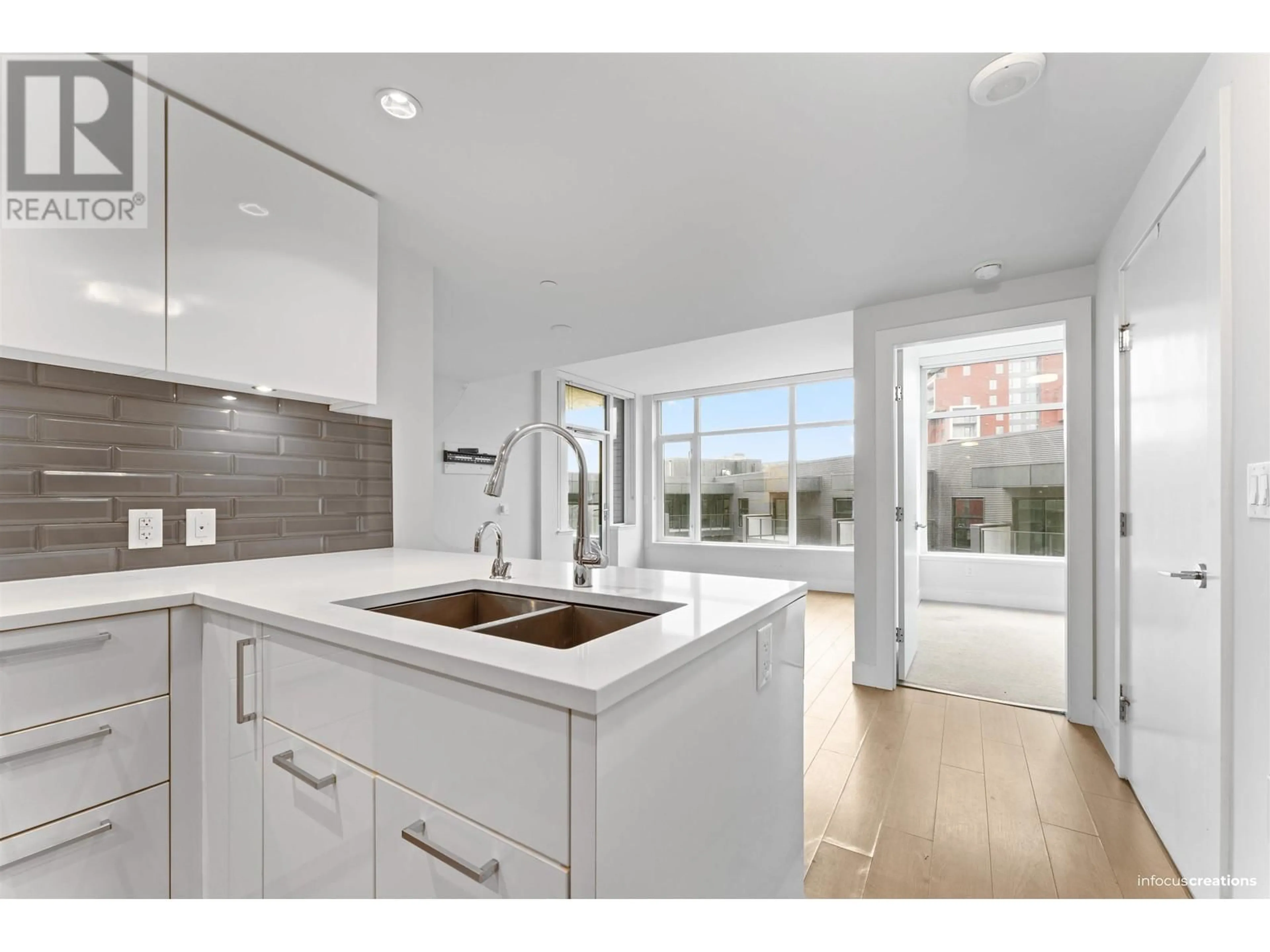 Open concept kitchen, ceramic/tile floor for 609 - 3451 SAWMILL CRESCENT, Vancouver British Columbia V5S0H3