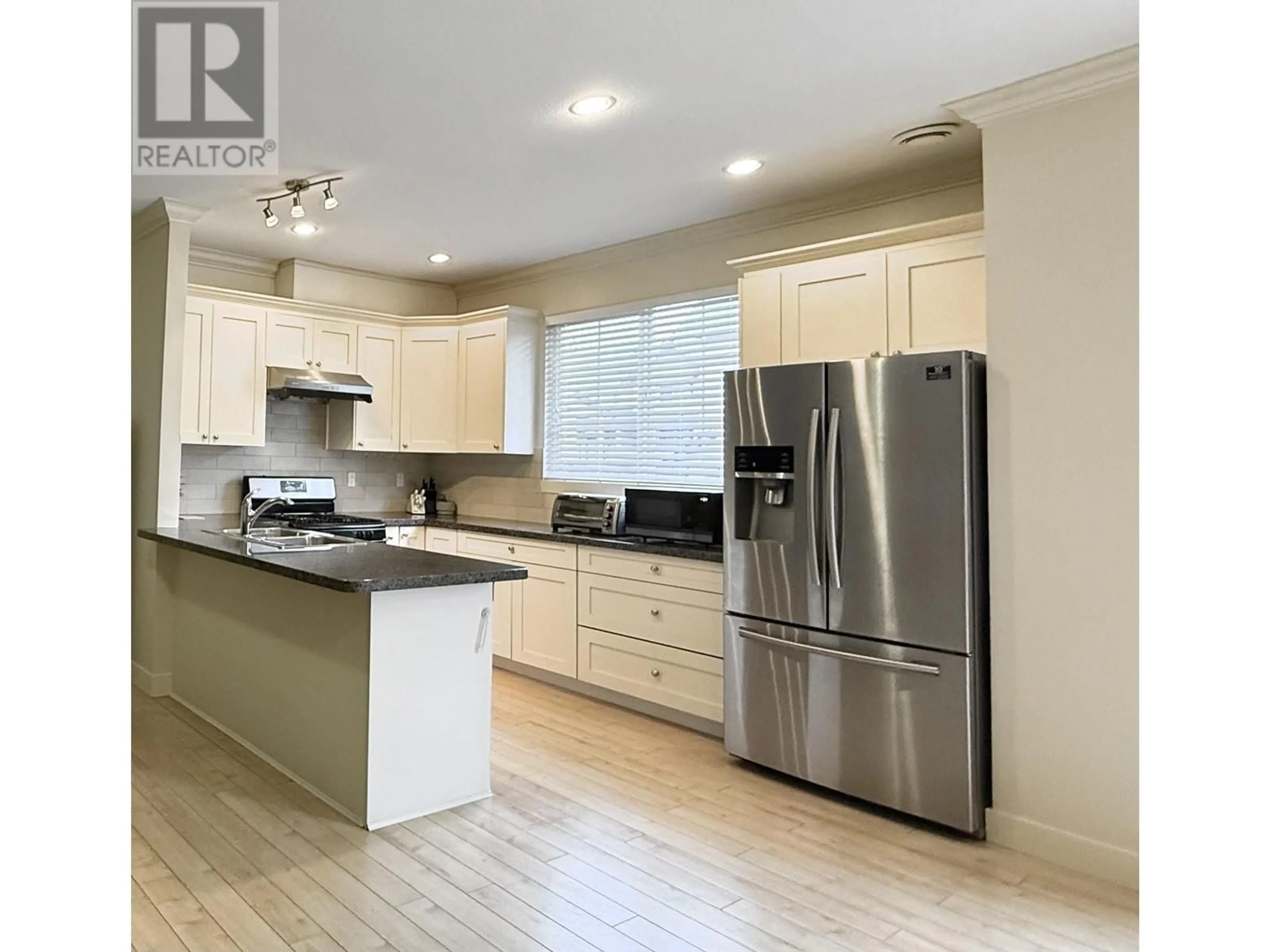 Open concept kitchen, wood/laminate floor for 34 - 12251 NO 2 ROAD, Richmond British Columbia V7E0A3