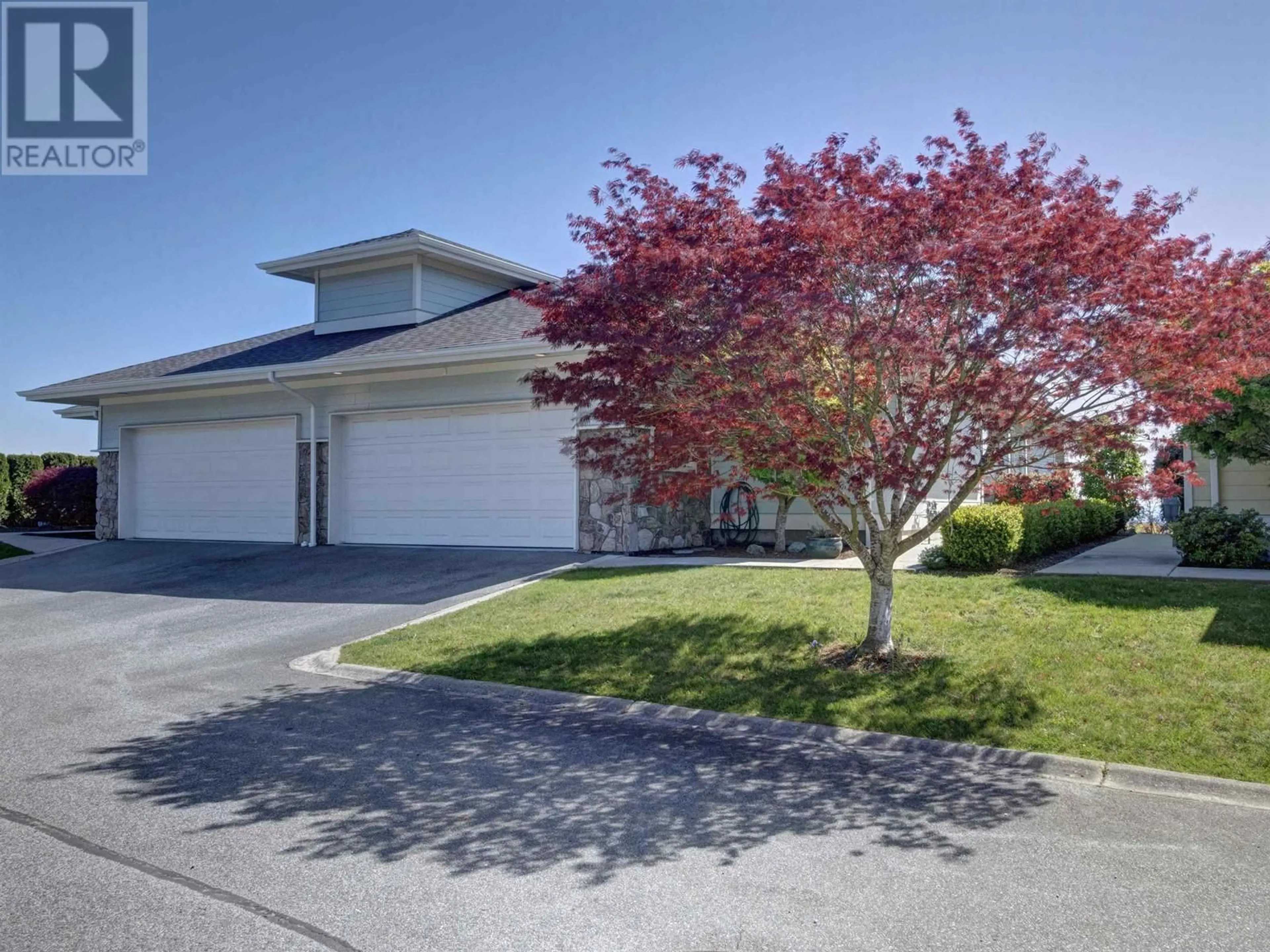 A pic from outside/outdoor area/front of a property/back of a property/a pic from drone, street for 7 - 5520 MCCOURT ROAD, Sechelt British Columbia V7Z0K7