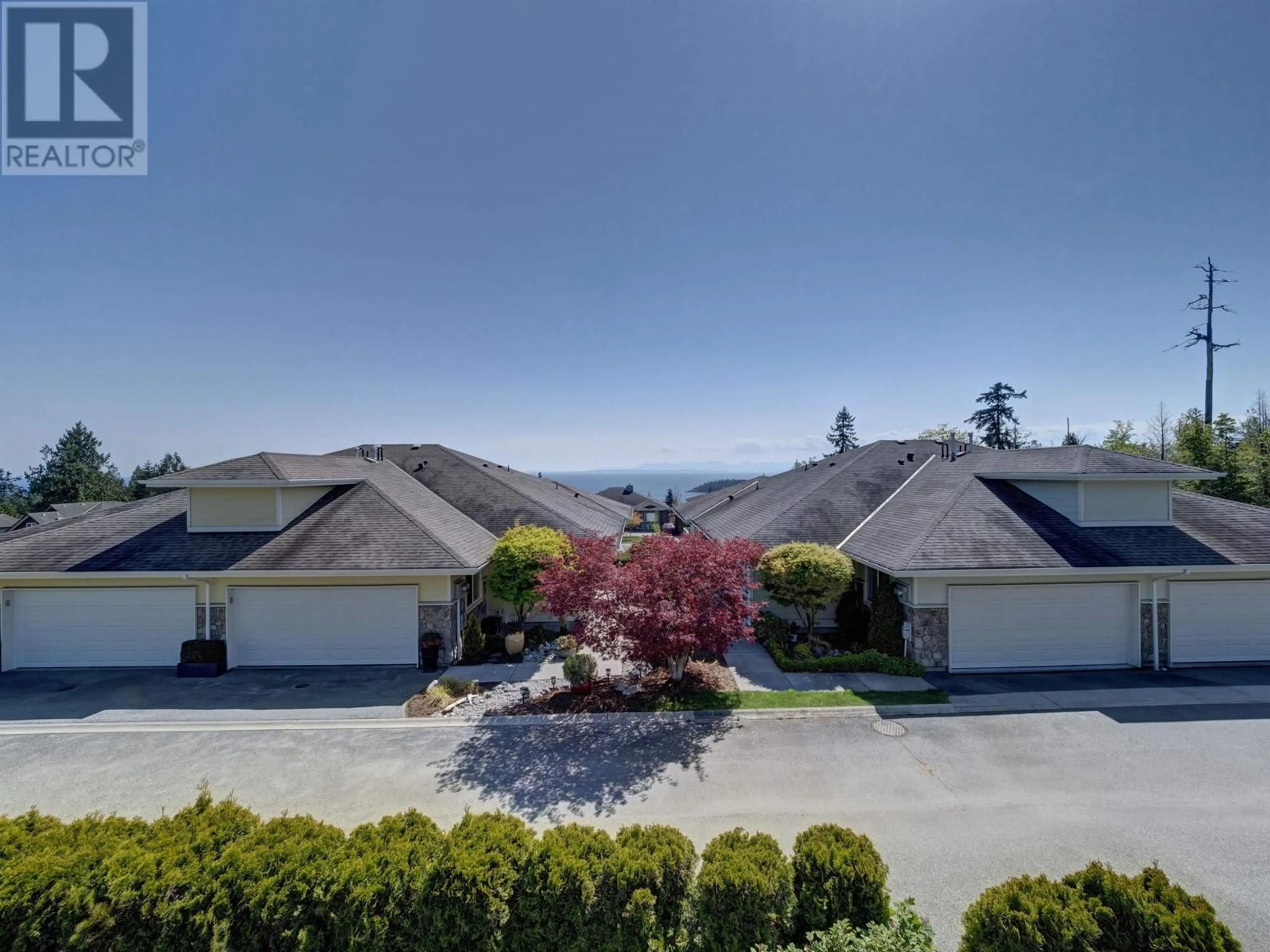 A pic from outside/outdoor area/front of a property/back of a property/a pic from drone, mountain view for 7 - 5520 MCCOURT ROAD, Sechelt British Columbia V7Z0K7