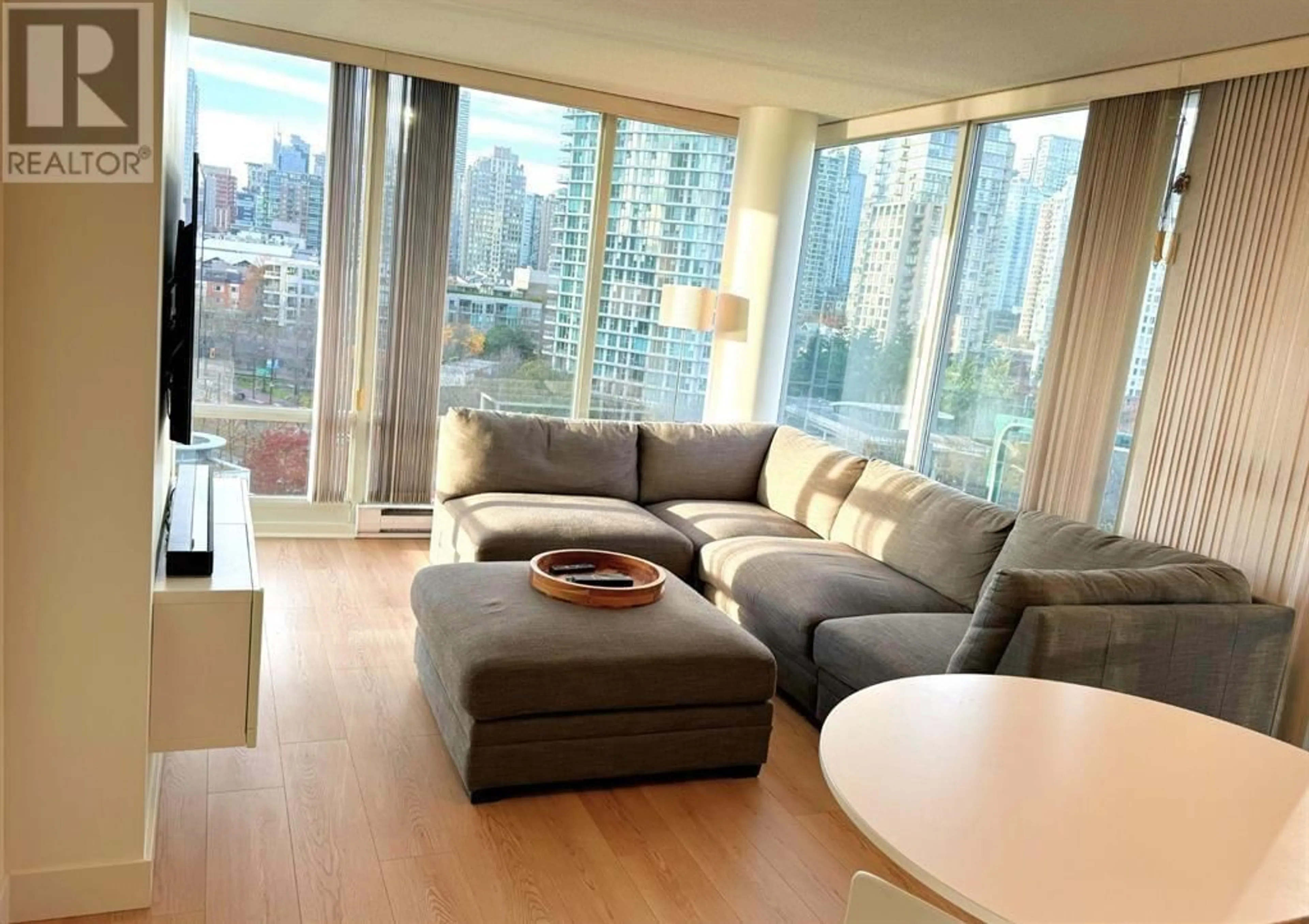 Living room with furniture, wood/laminate floor for 1101 - 1033 MARINASIDE CRESCENT, Vancouver British Columbia V6Z3A3