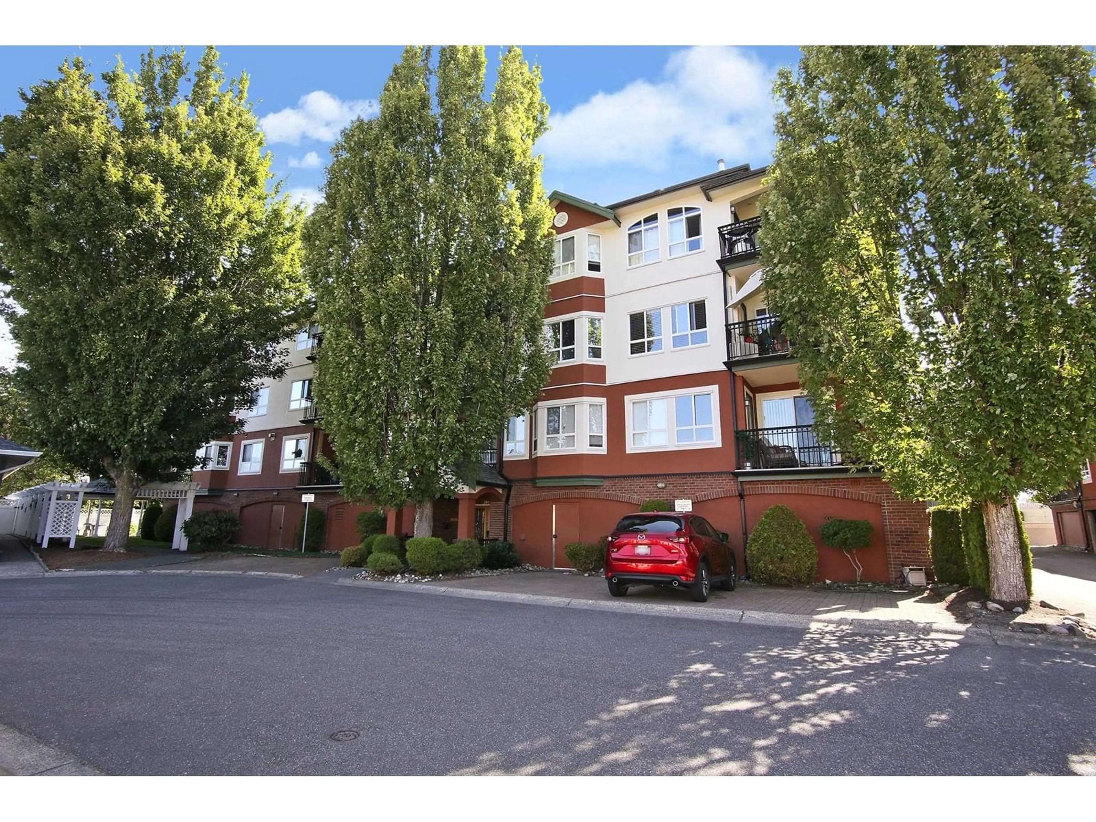 A pic from outside/outdoor area/front of a property/back of a property/a pic from drone, street for 2407 - 8485 YOUNG ROAD, Chilliwack British Columbia V2P7Y7