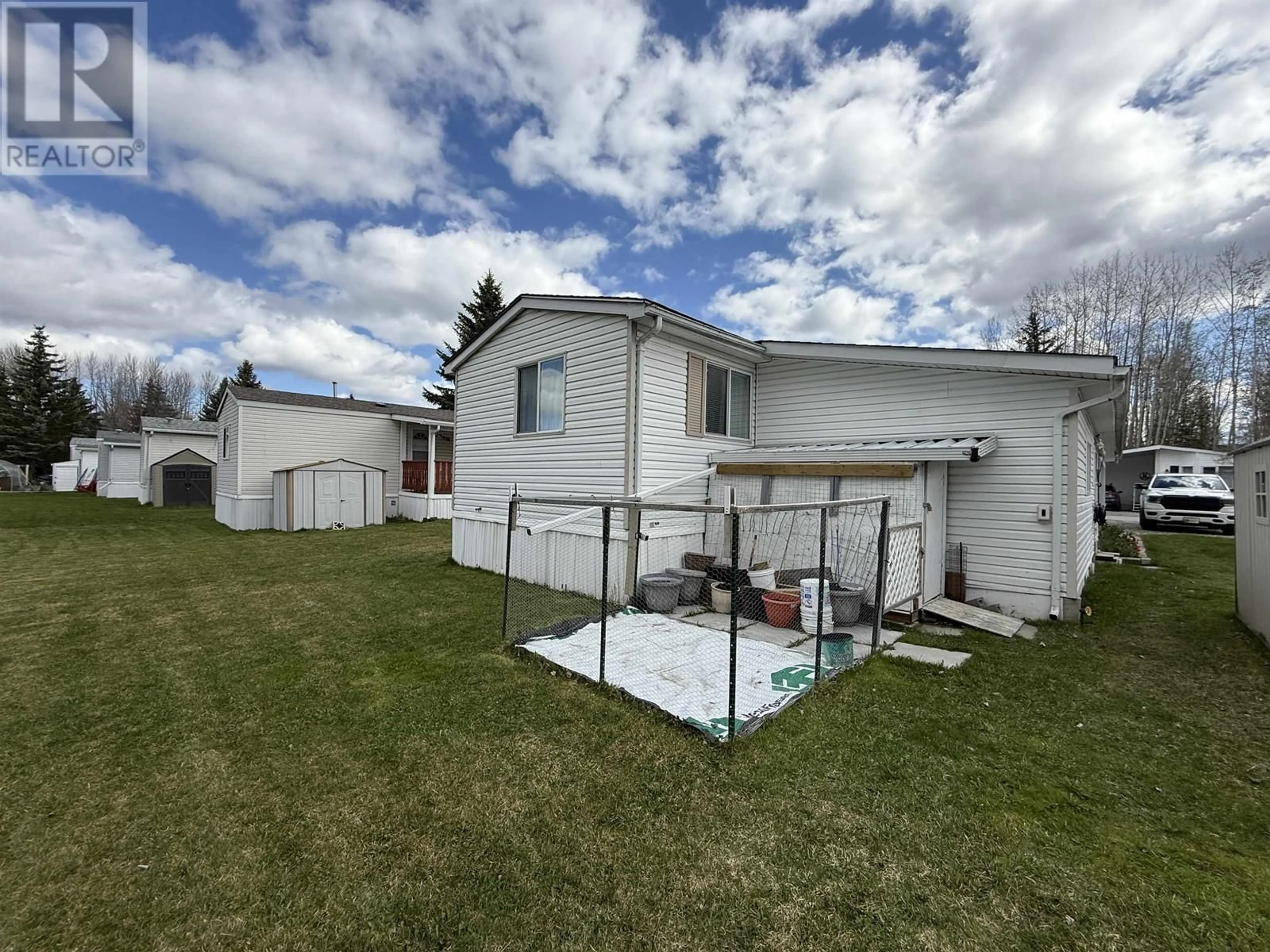 A pic from outside/outdoor area/front of a property/back of a property/a pic from drone, unknown for 14 - 2121 BALSAM AVENUE, Quesnel British Columbia V2J5J3