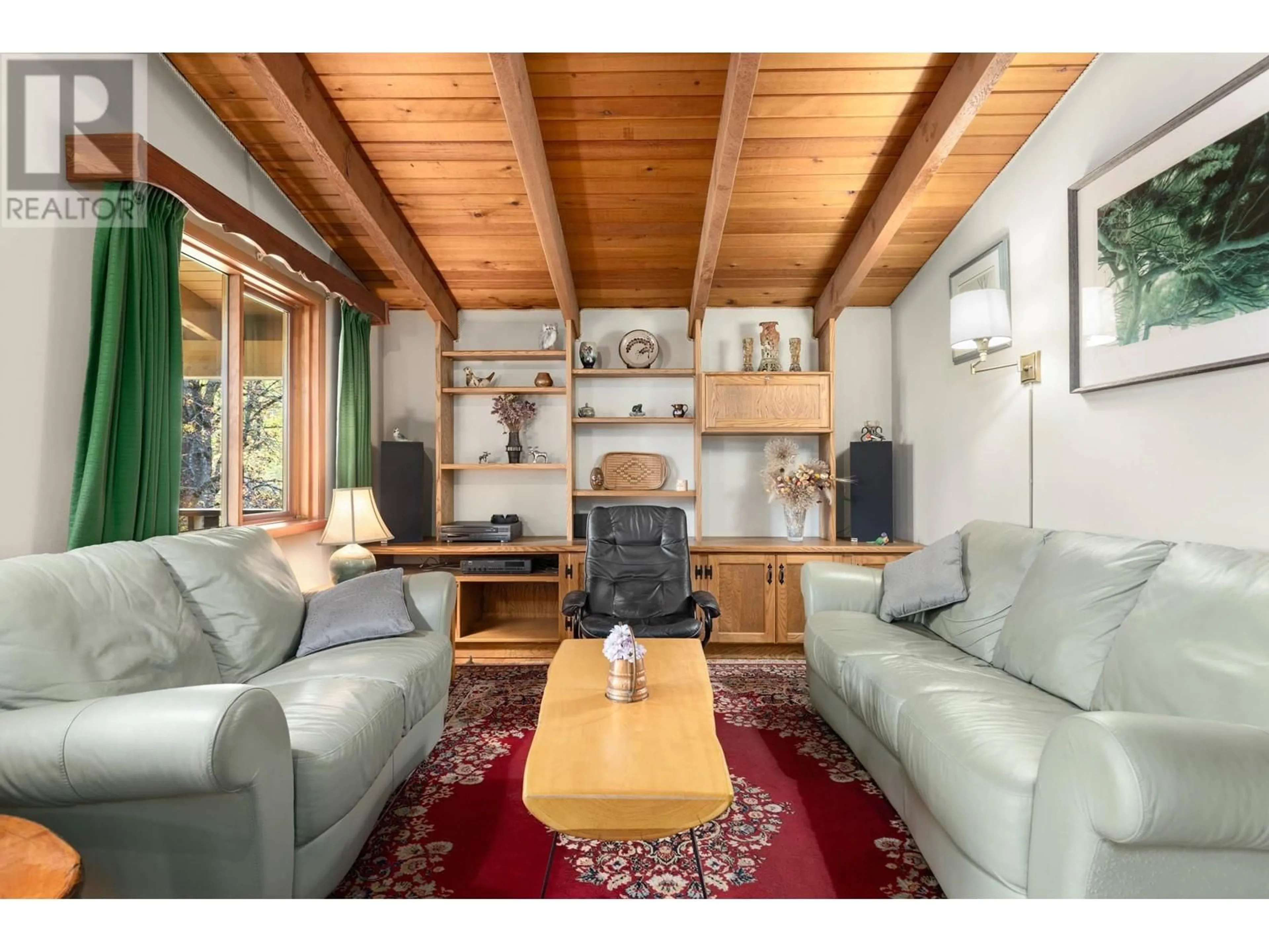 Living room with furniture, wood/laminate floor for 7869 PEMBERTON MEADOWS ROAD, Pemberton British Columbia V0N2L2
