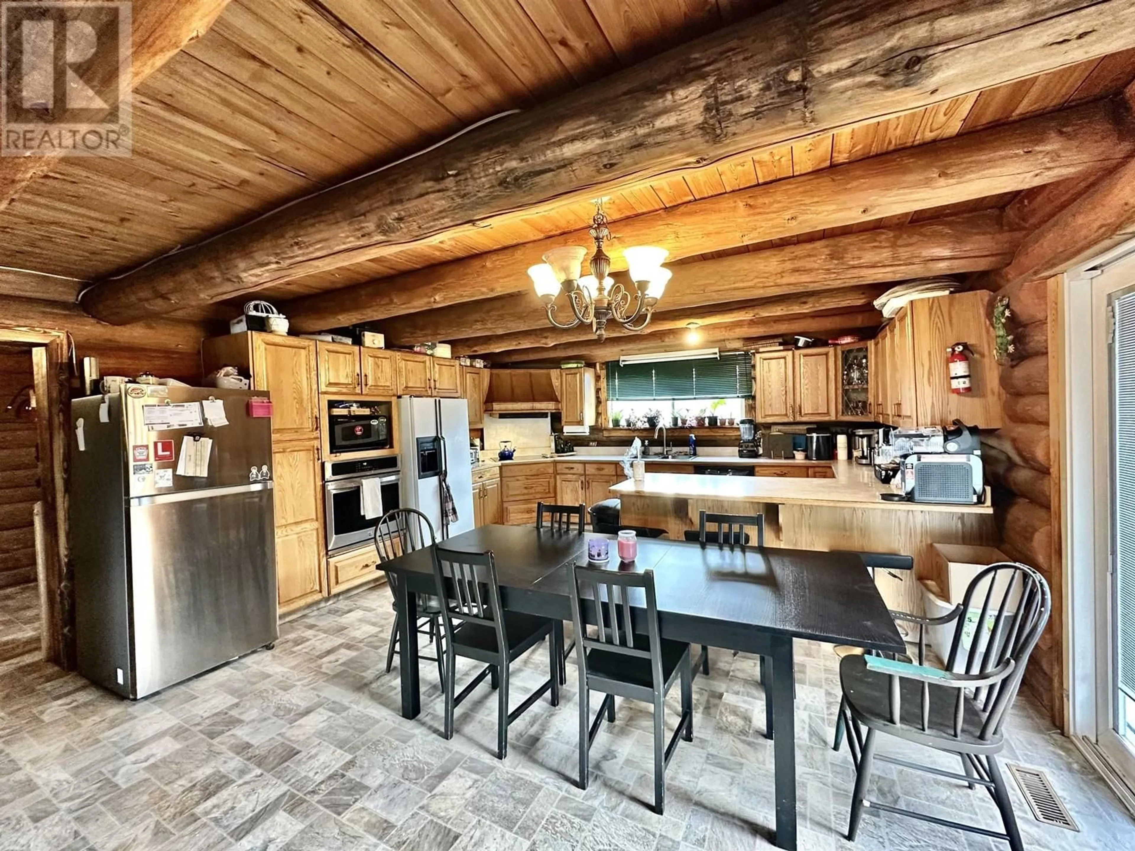 Rustic kitchen, wood/laminate floor for 1100 7TH AVENUE, Valemount British Columbia V0E2Z0