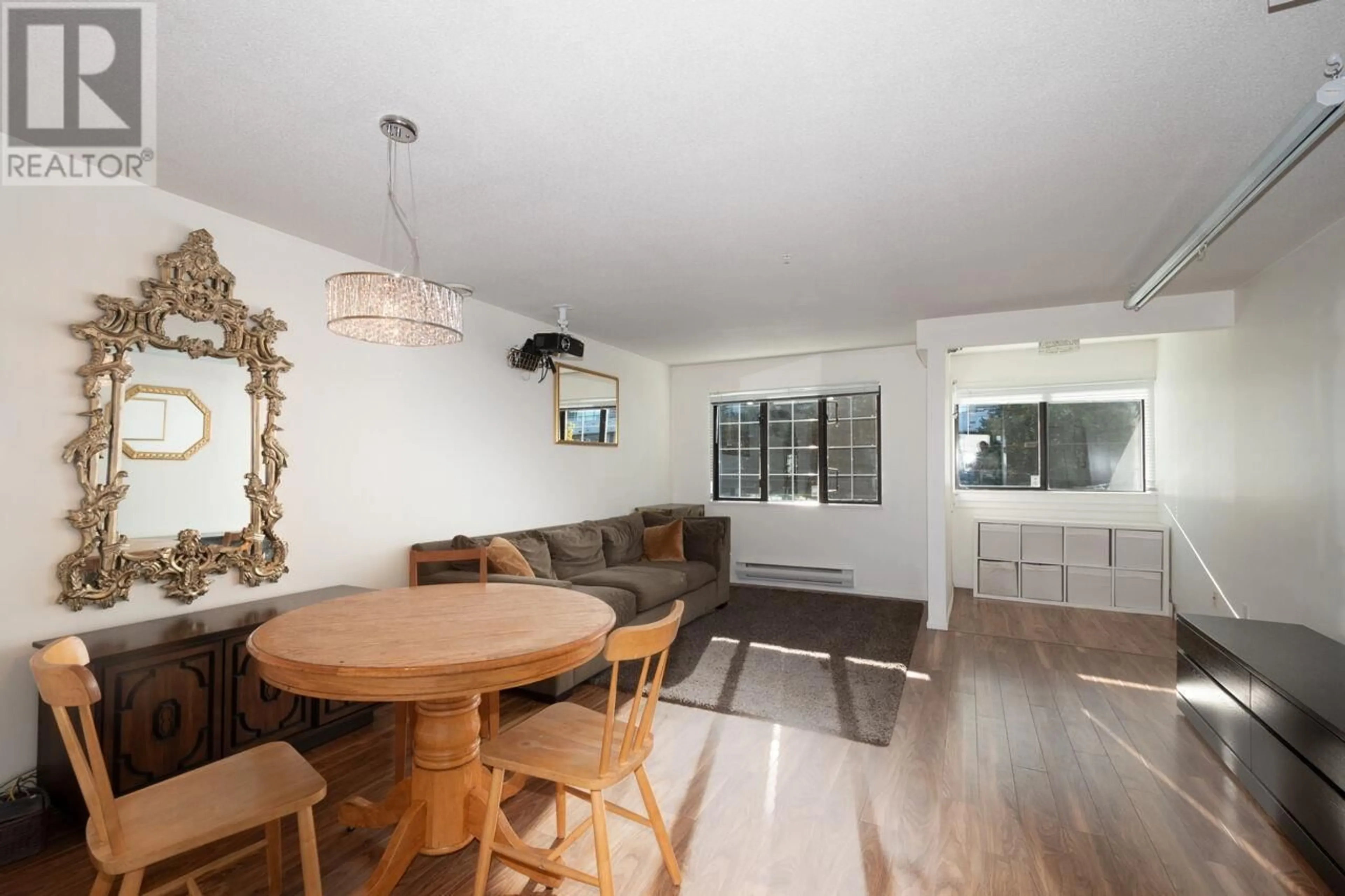 Dining room, wood/laminate floor for 203 - 3368 MAIN STREET, Vancouver British Columbia V5V3M7