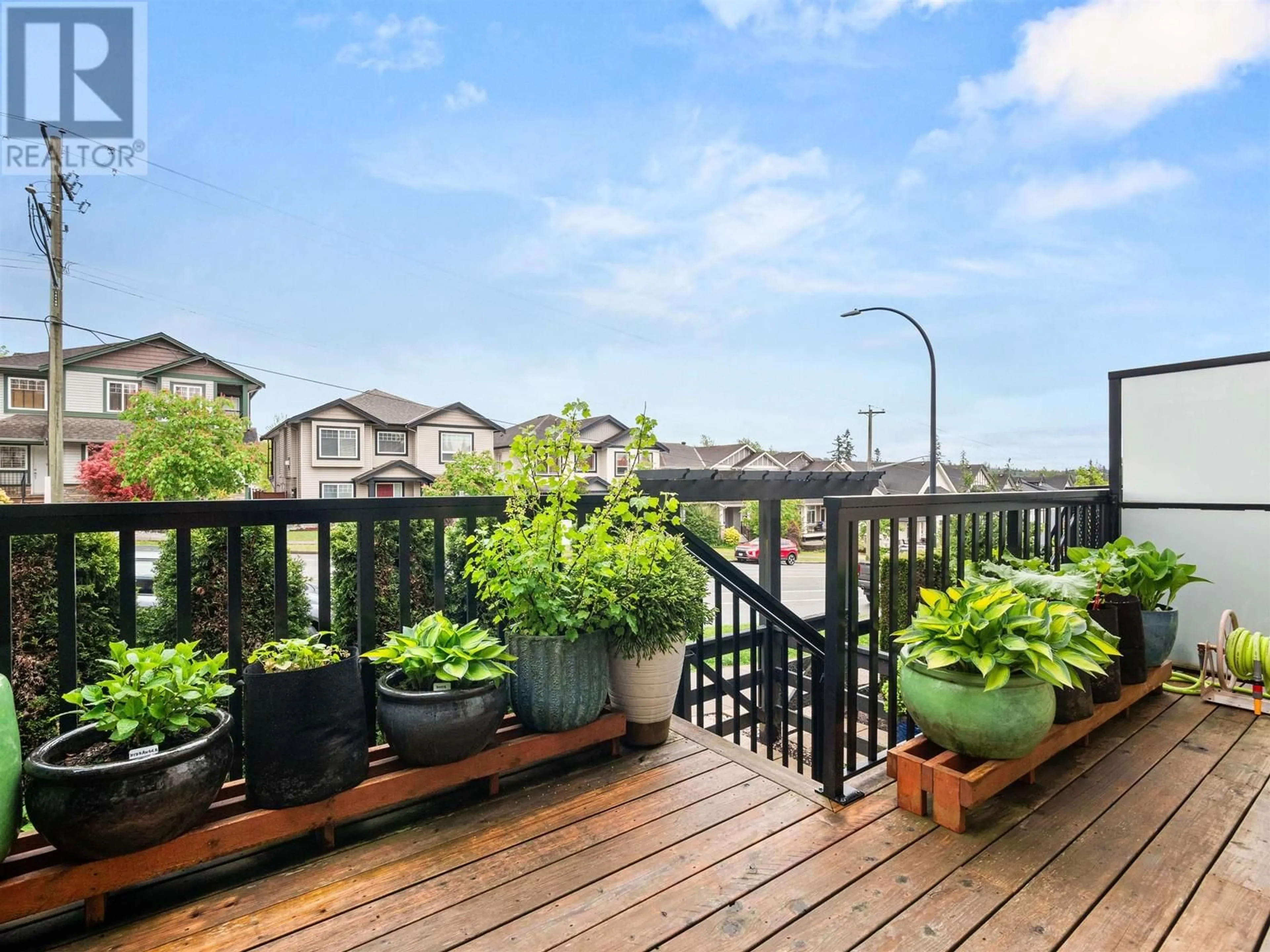 Patio, city buildings view from balcony for 3 - 11305 240 STREET, Maple Ridge British Columbia V2W0J1