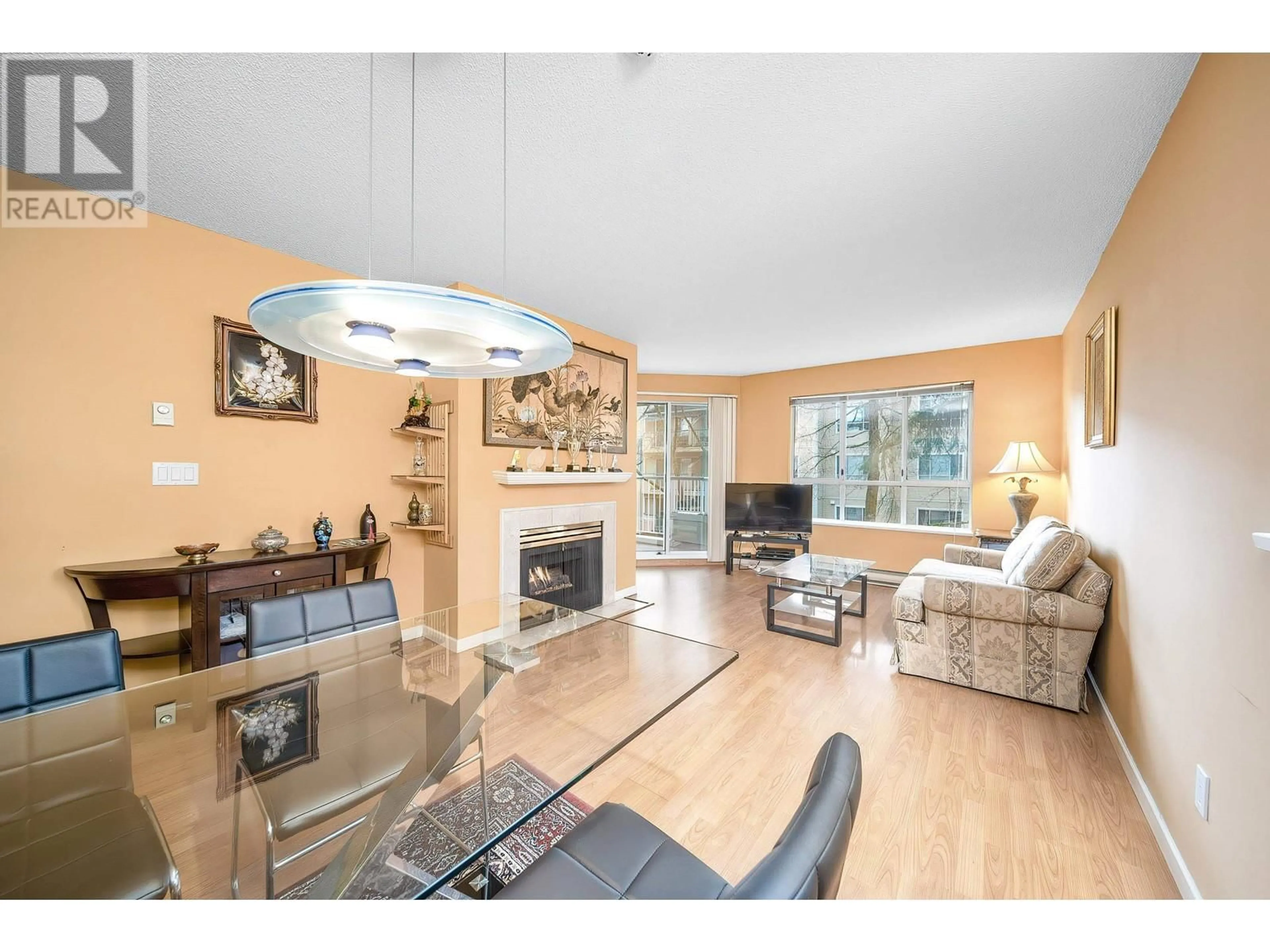 Living room with furniture, wood/laminate floor for 221 - 8600 GENERAL CURRIE ROAD, Richmond British Columbia V6Y3V6
