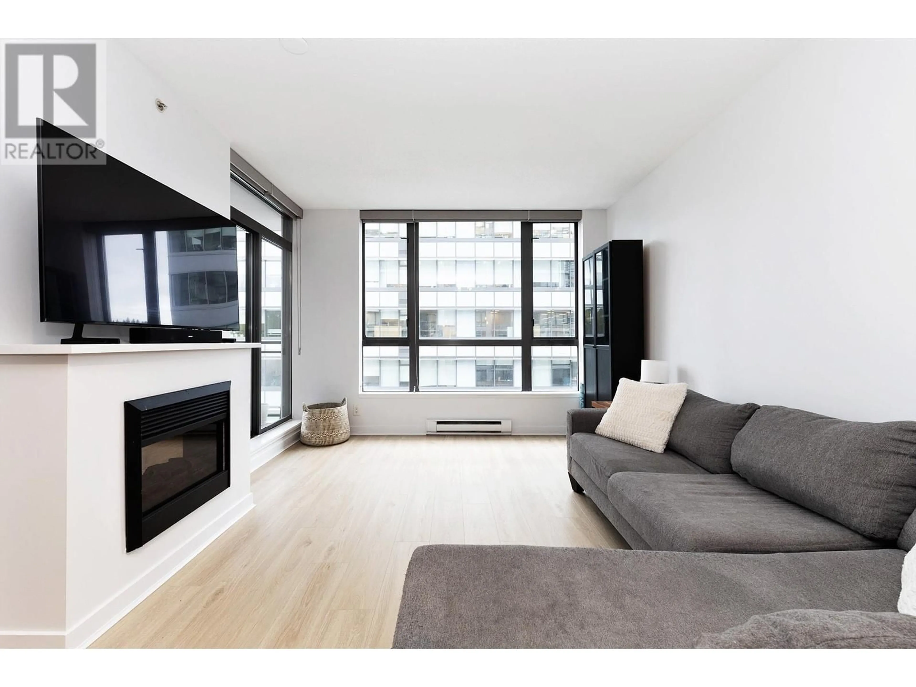 Living room with furniture, wood/laminate floor for 509 - 400 CAPILANO ROAD, Port Moody British Columbia V3H0E1