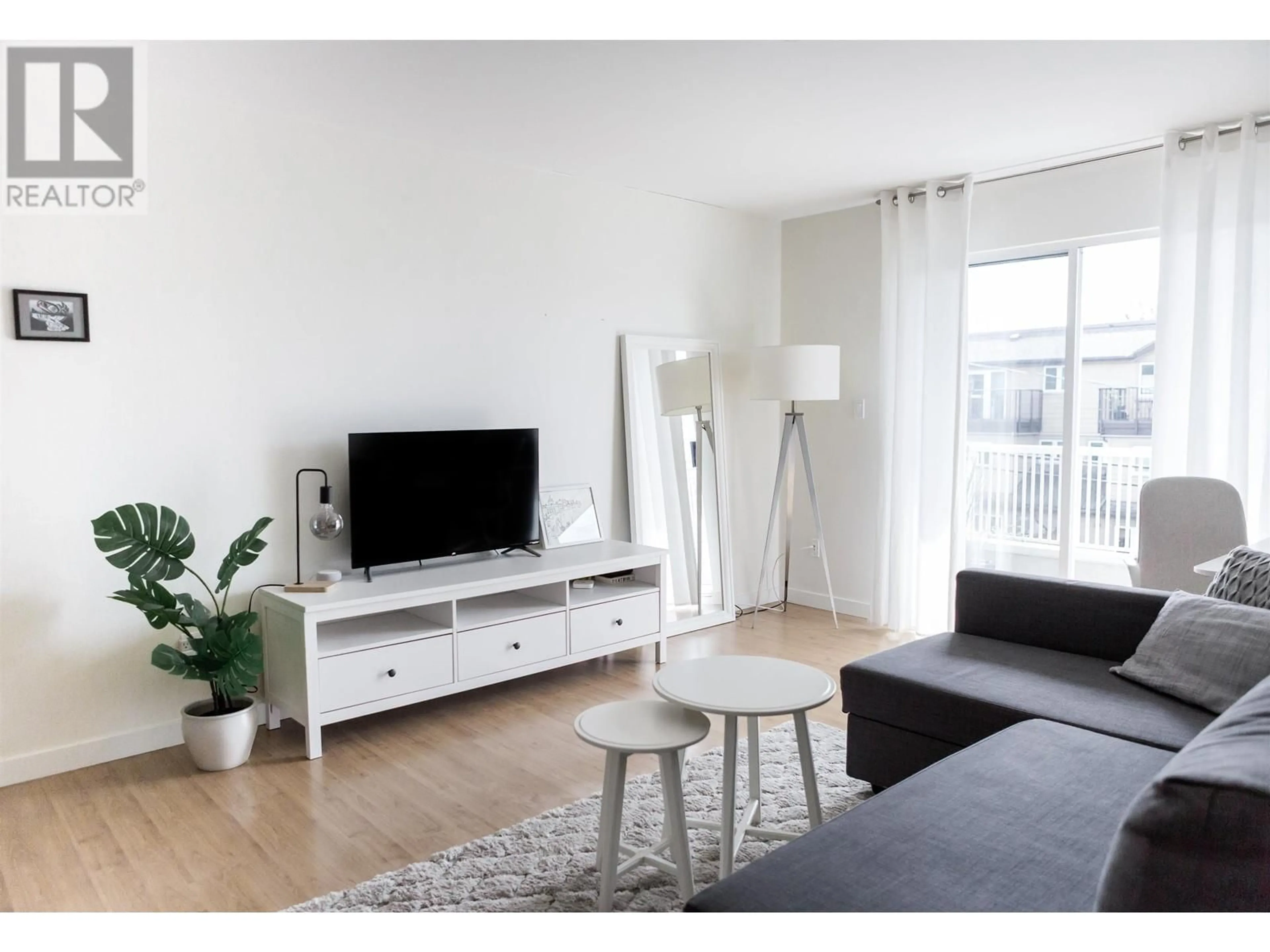 Living room with furniture, wood/laminate floor for 306 - 458 43RD AVENUE, Vancouver British Columbia V5W1T4