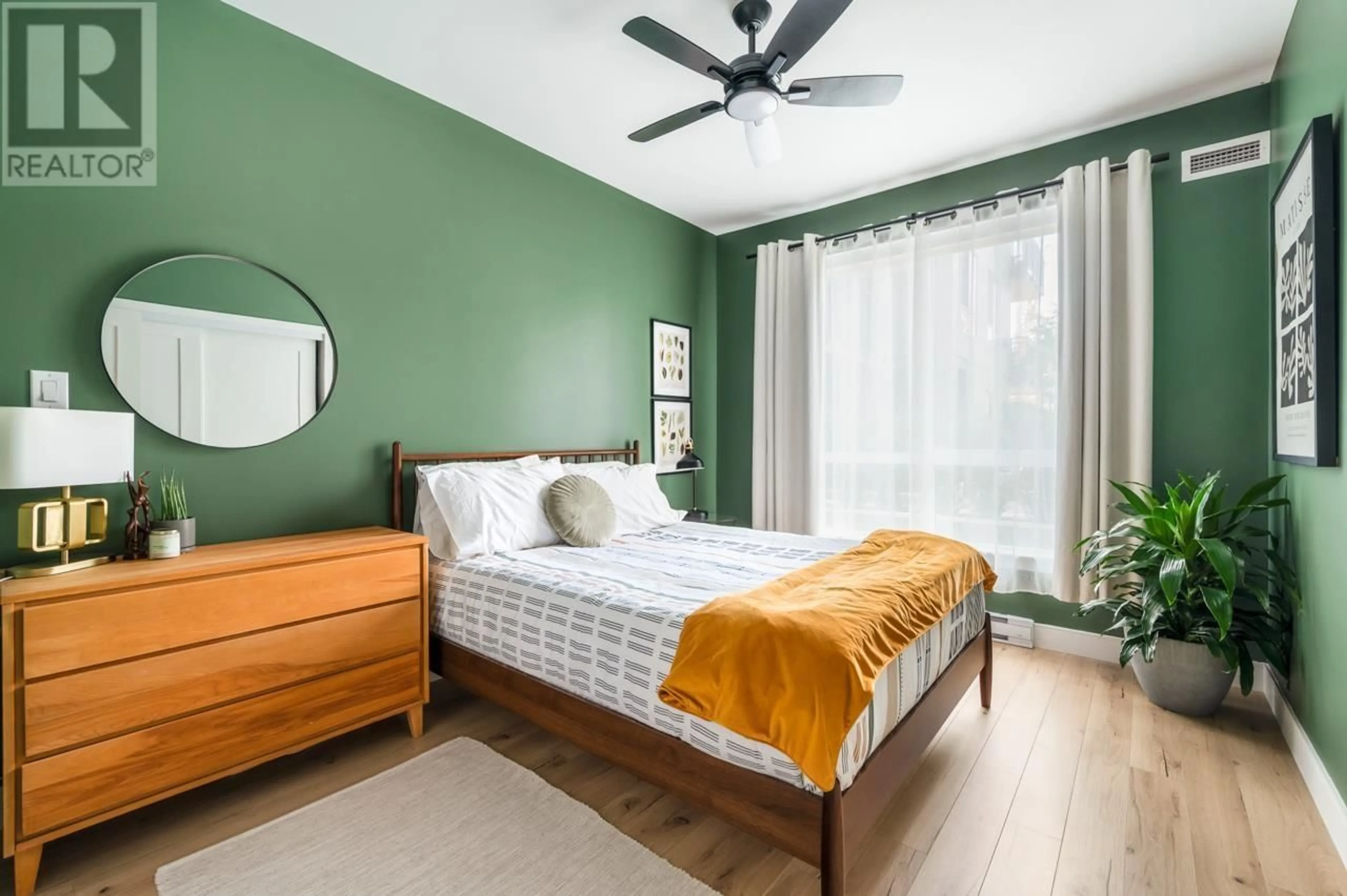 Bedroom with bed, wood/laminate floor for 206 - 3131 MURRAY STREET, Port Moody British Columbia V3H0L9