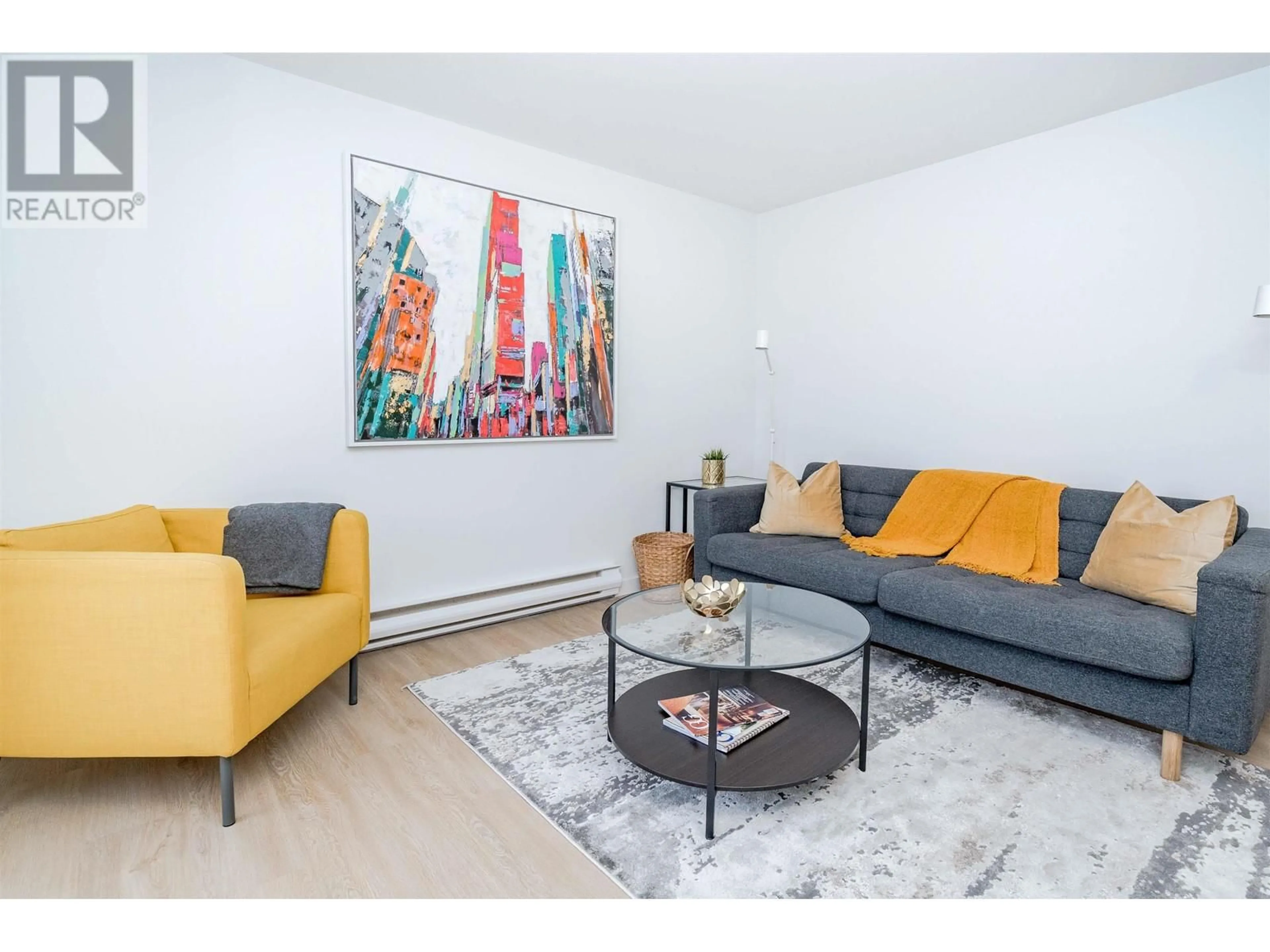 Living room with furniture, wood/laminate floor for 303 - 8690 MONTCALM STREET, Vancouver British Columbia V6P4P8