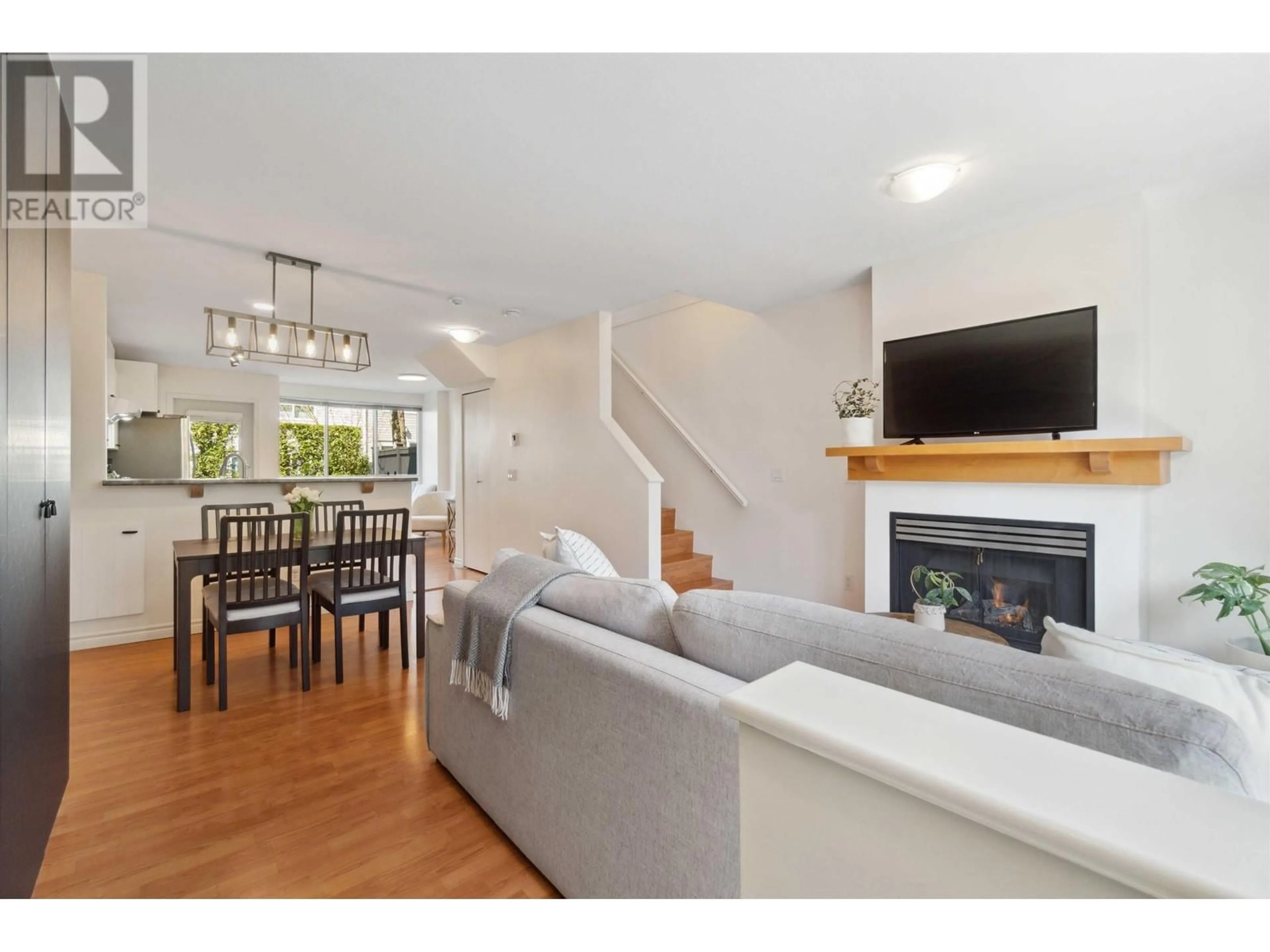 Living room with furniture, wood/laminate floor for 7360 HAWTHORNE TERRACE, Burnaby British Columbia V5E4M4
