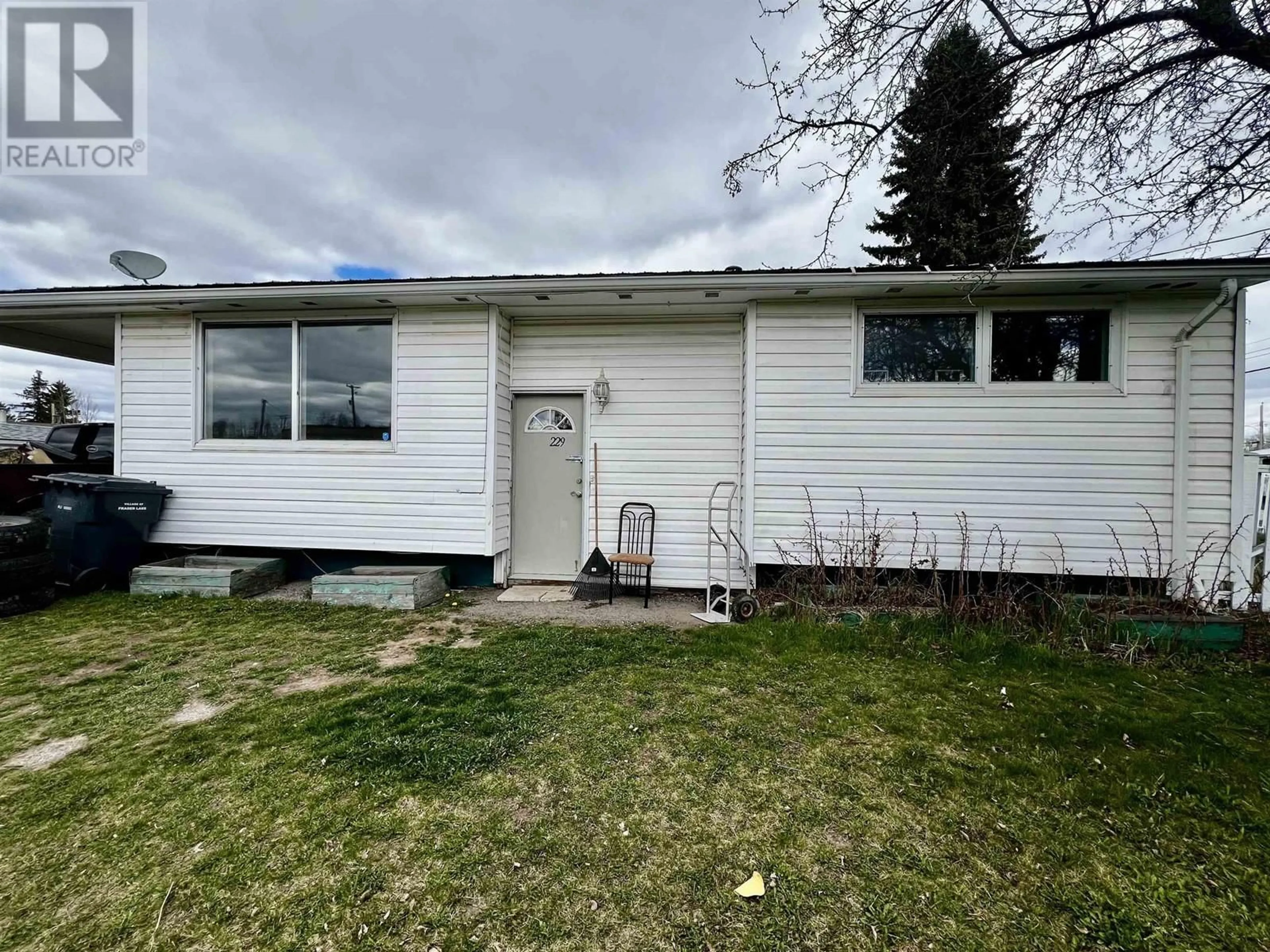 Home with vinyl exterior material, street for 229 ENDAKO AVENUE, Fraser Lake British Columbia V0J1S0