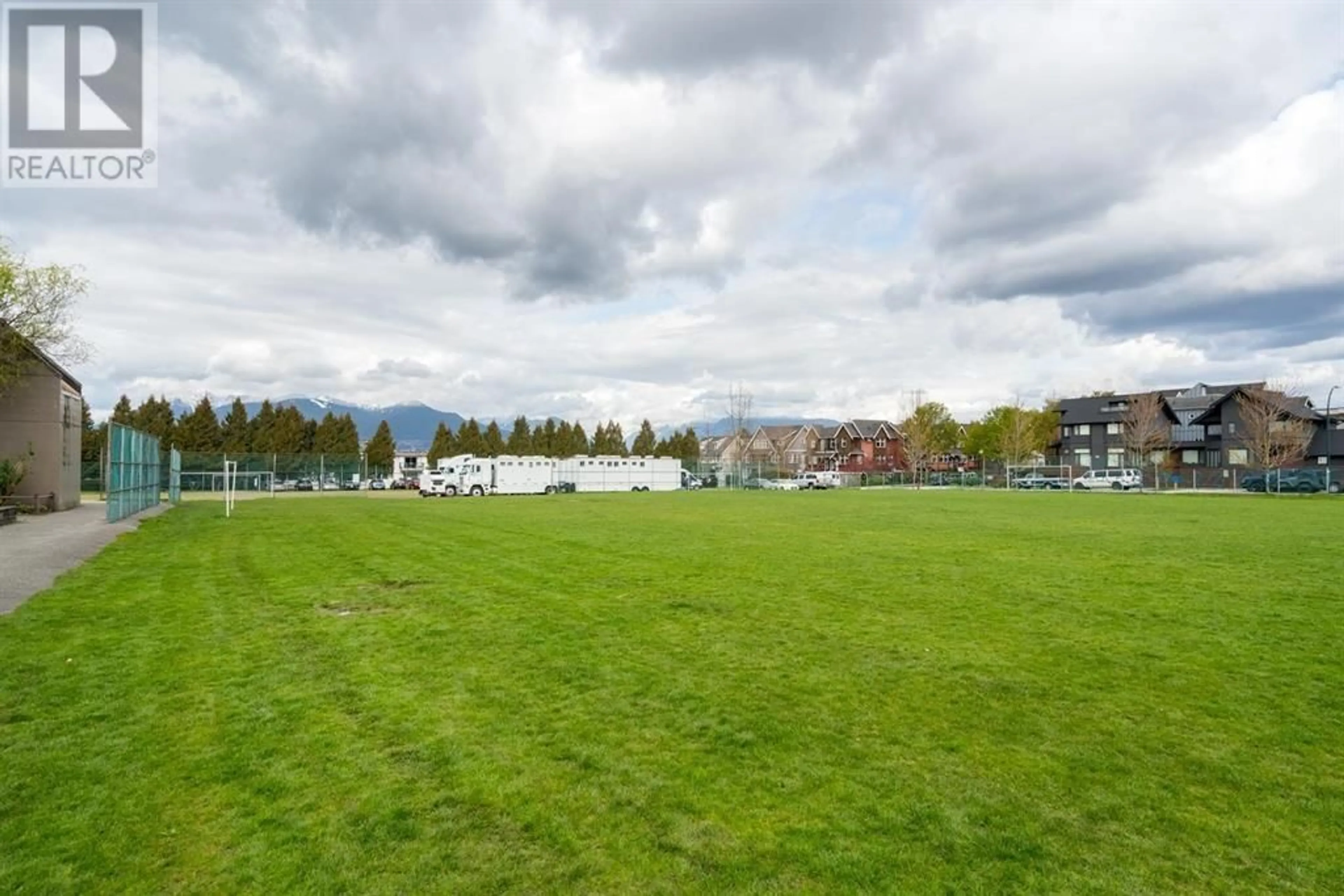 A pic from outside/outdoor area/front of a property/back of a property/a pic from drone, unknown for 215 - 3150 PRINCE EDWARD STREET, Vancouver British Columbia V5T3N6